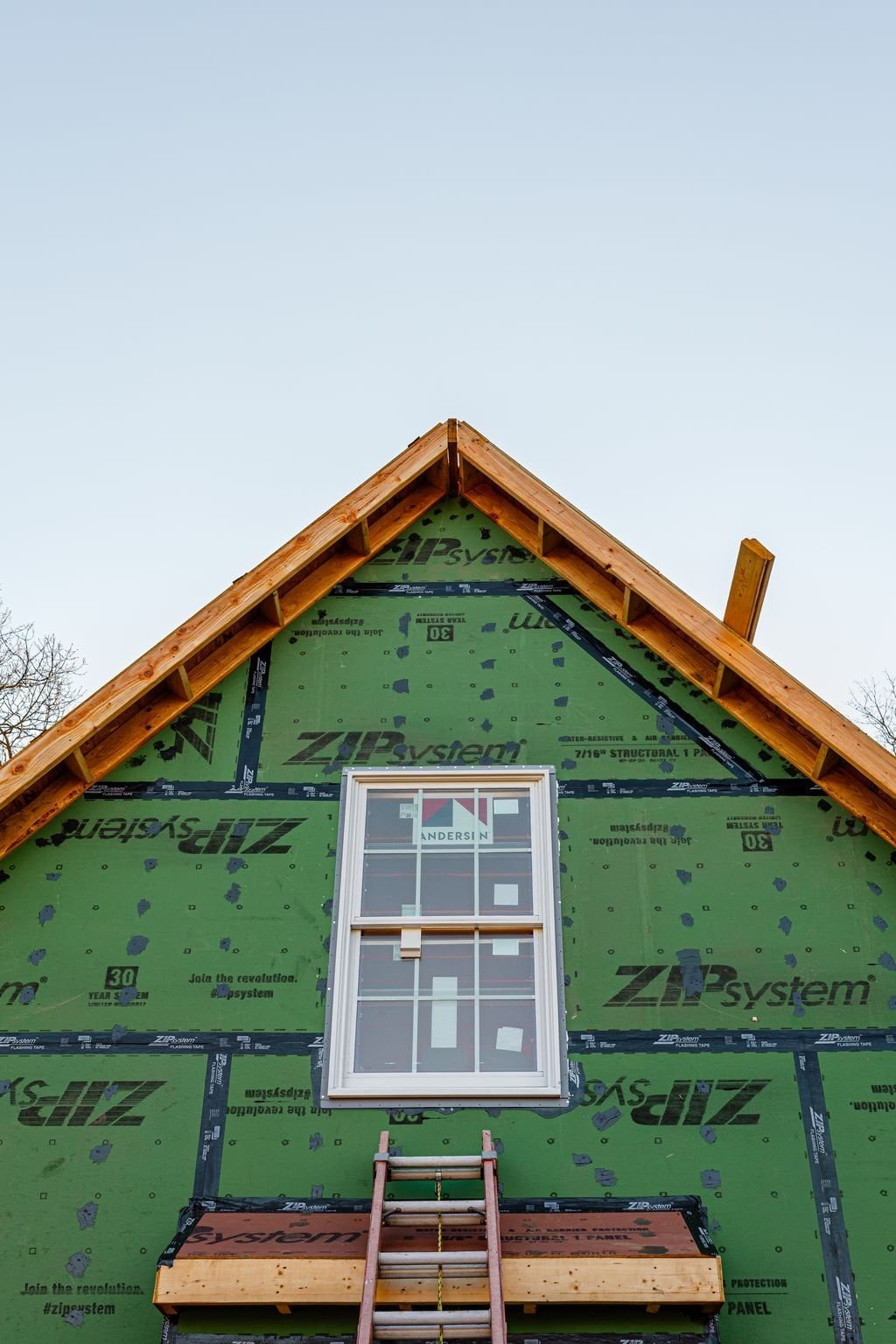 Window installation in the gable of a Bucks County cottage addition