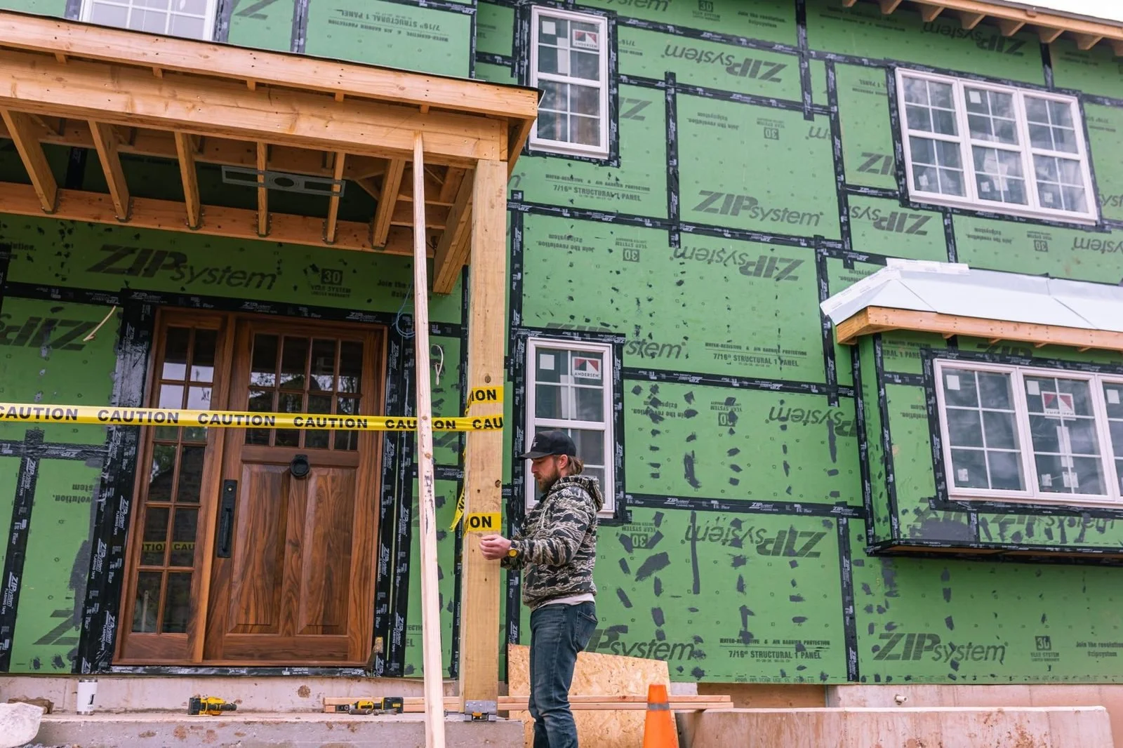 New wood front door and porch framing on a Bucks County farmhouse addition