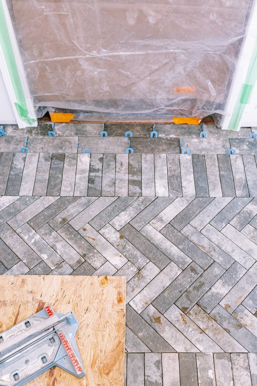 Herringbone brick-look tile floor in a Bucks County cottage