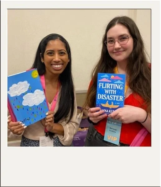Author and fan holding custom book cover