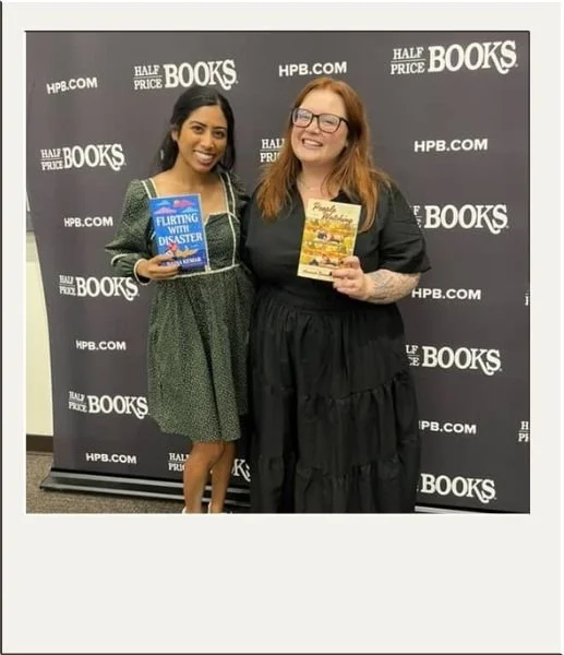 Authors holding their books at a book tour