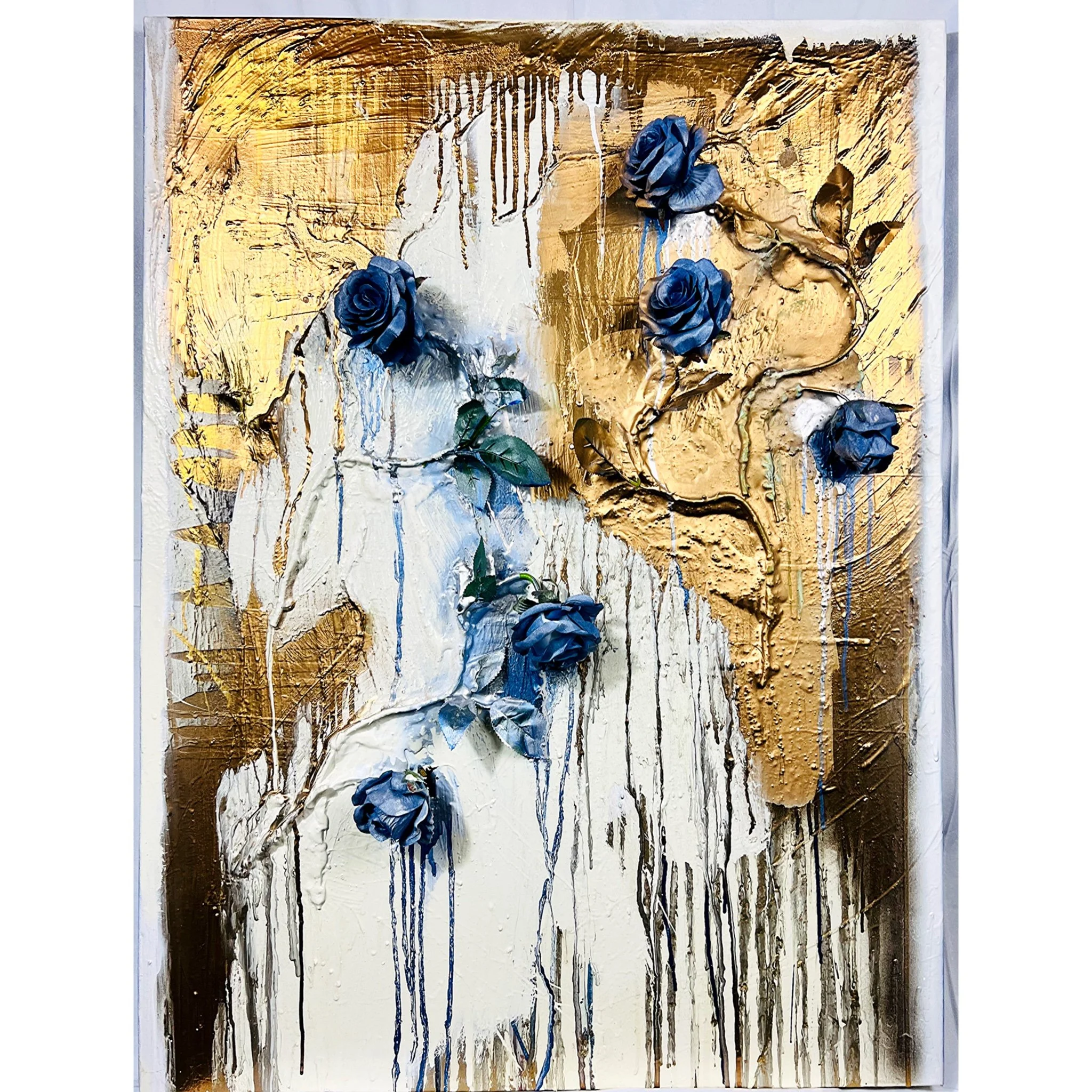 Abstract mixed media artwork with blue roses and dripping gold and white paint.