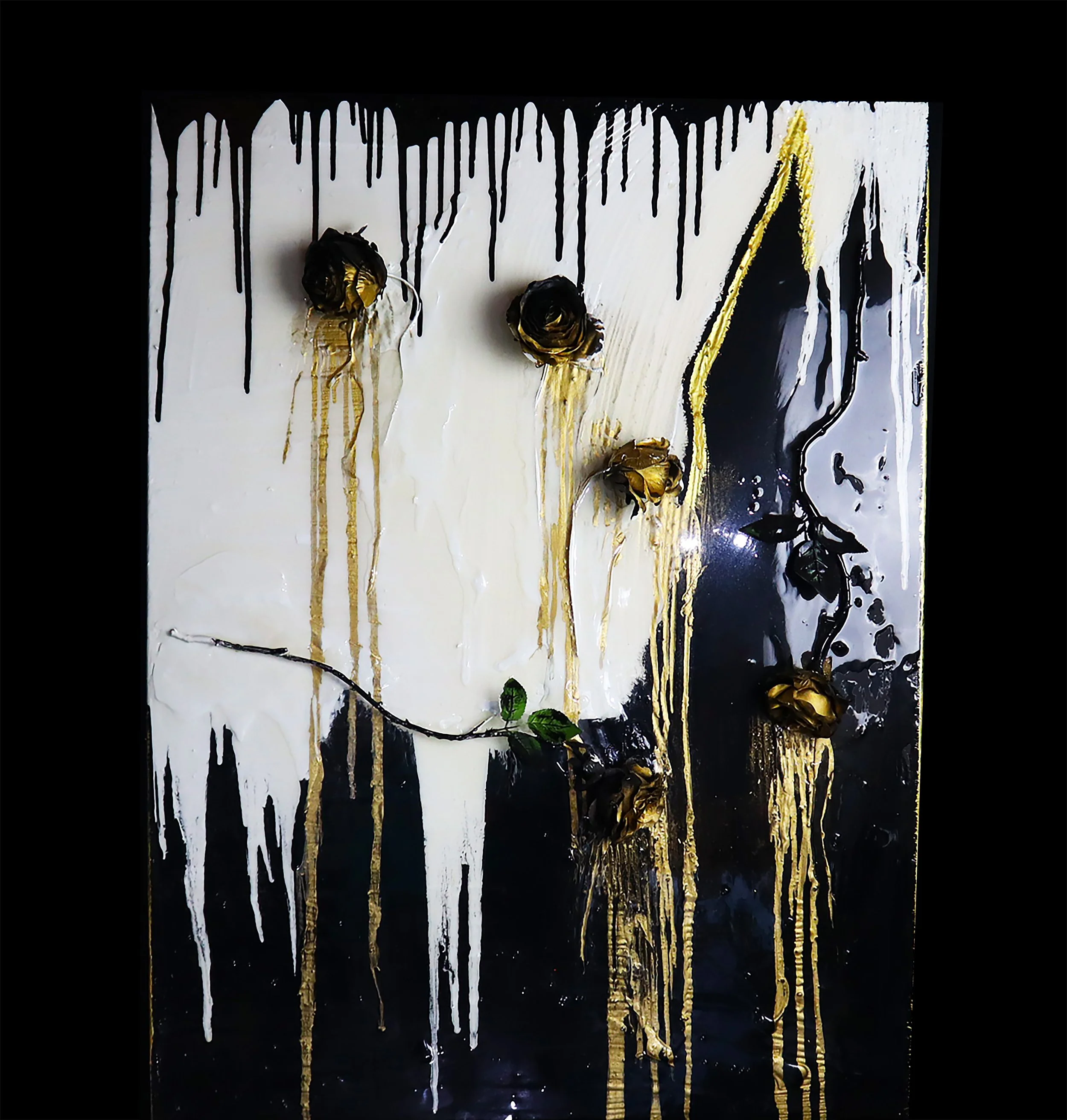 Abstract mixed media artwork featuring black, white, and gold paint splatters and drips with 3D gold and black roses on a black background.