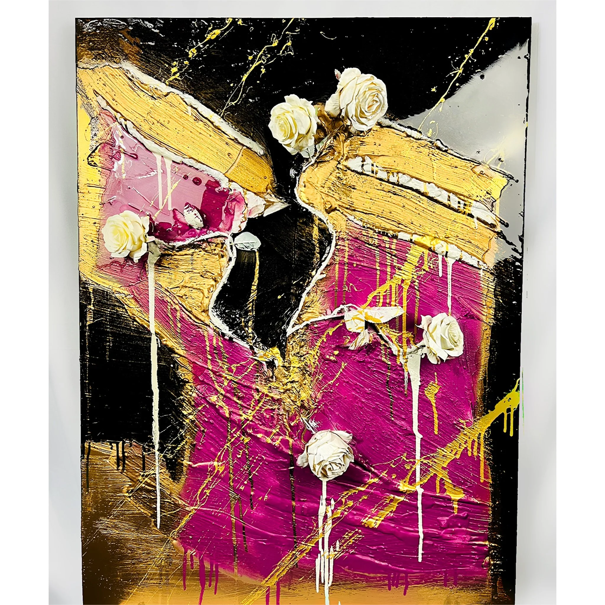 Abstract mixed media artwork with bold black, gold, pink, and white colors, featuring textured paint and four white roses arranged atop the painting.