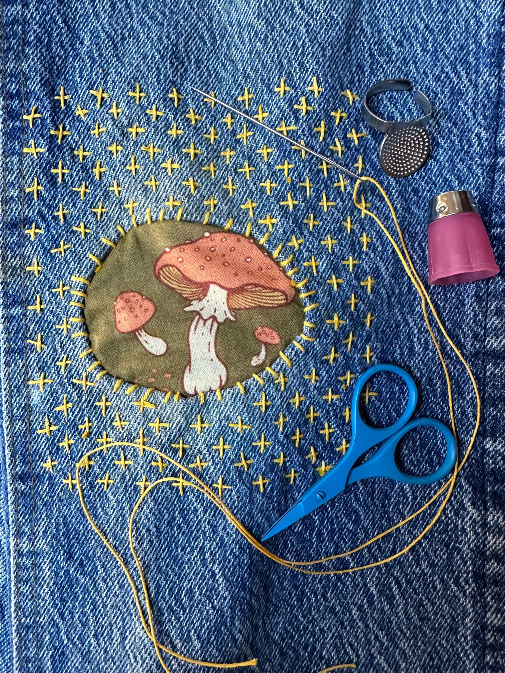 Katie mushroom patch knee mend with tools.jpg