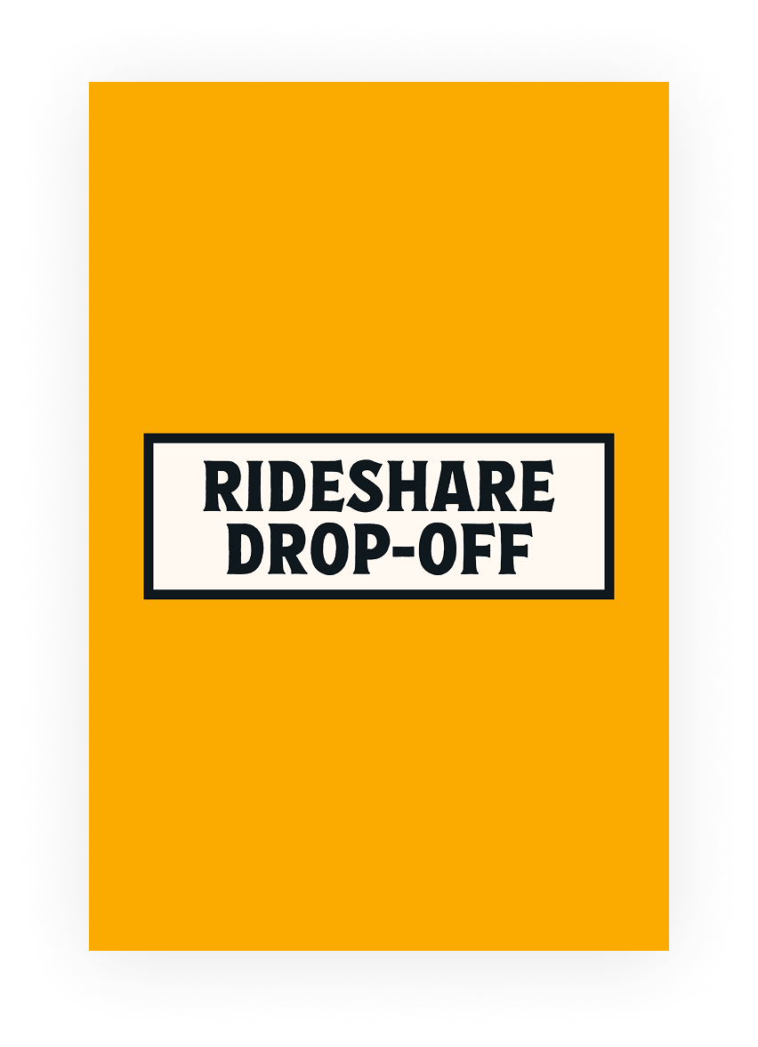 Sign for Rideshare Drop-Off with orange background and black border