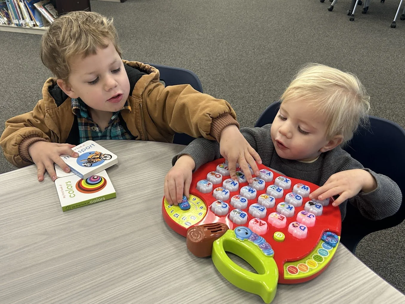young patrons using apply alphabet toy