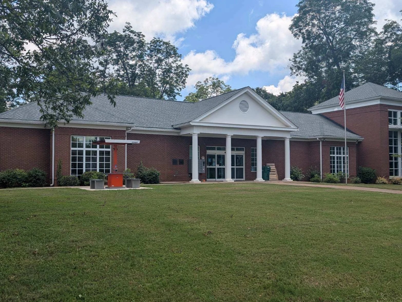 The brick exterior and front entrance of the Jasper County Library