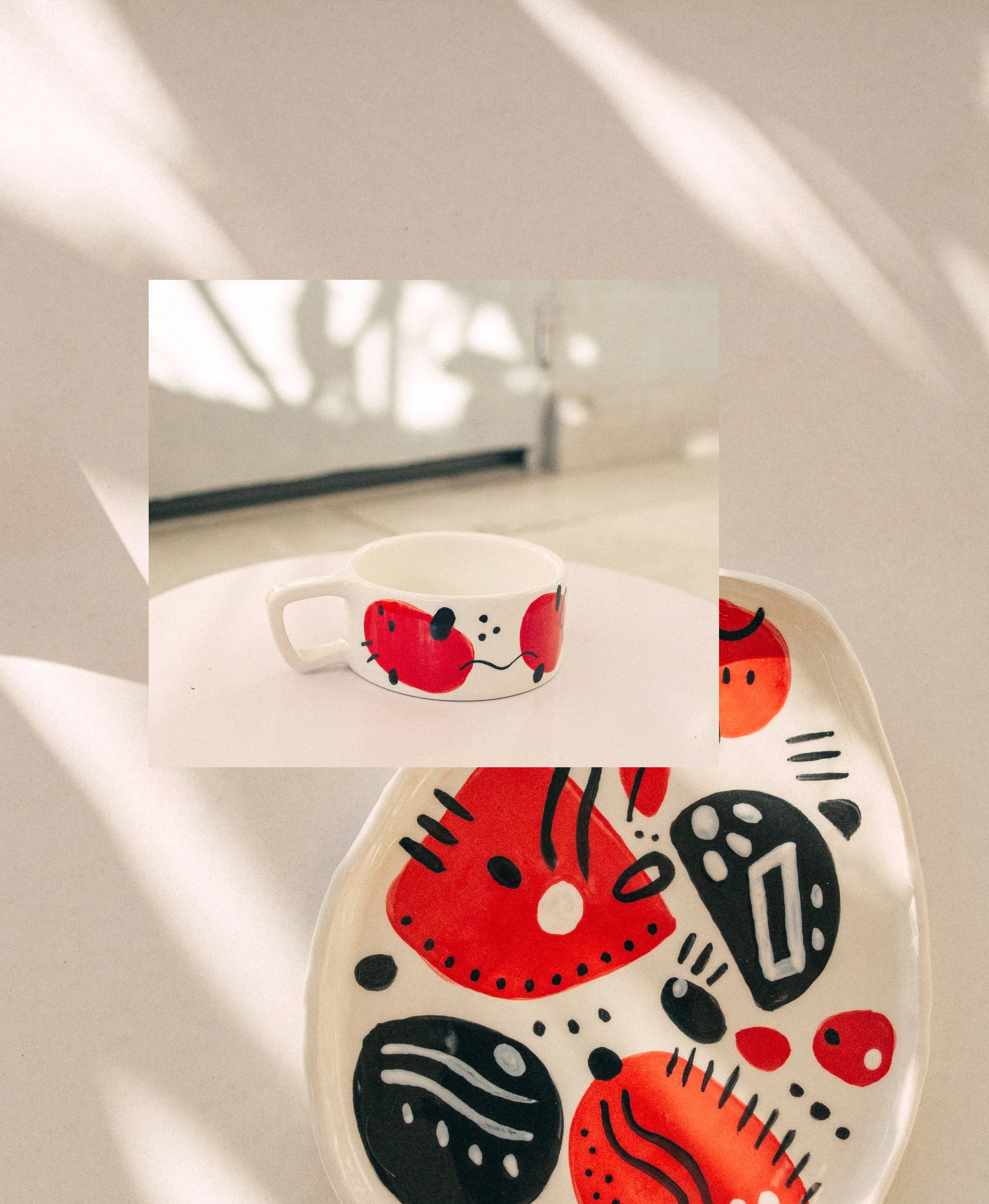 black and red cup and plate