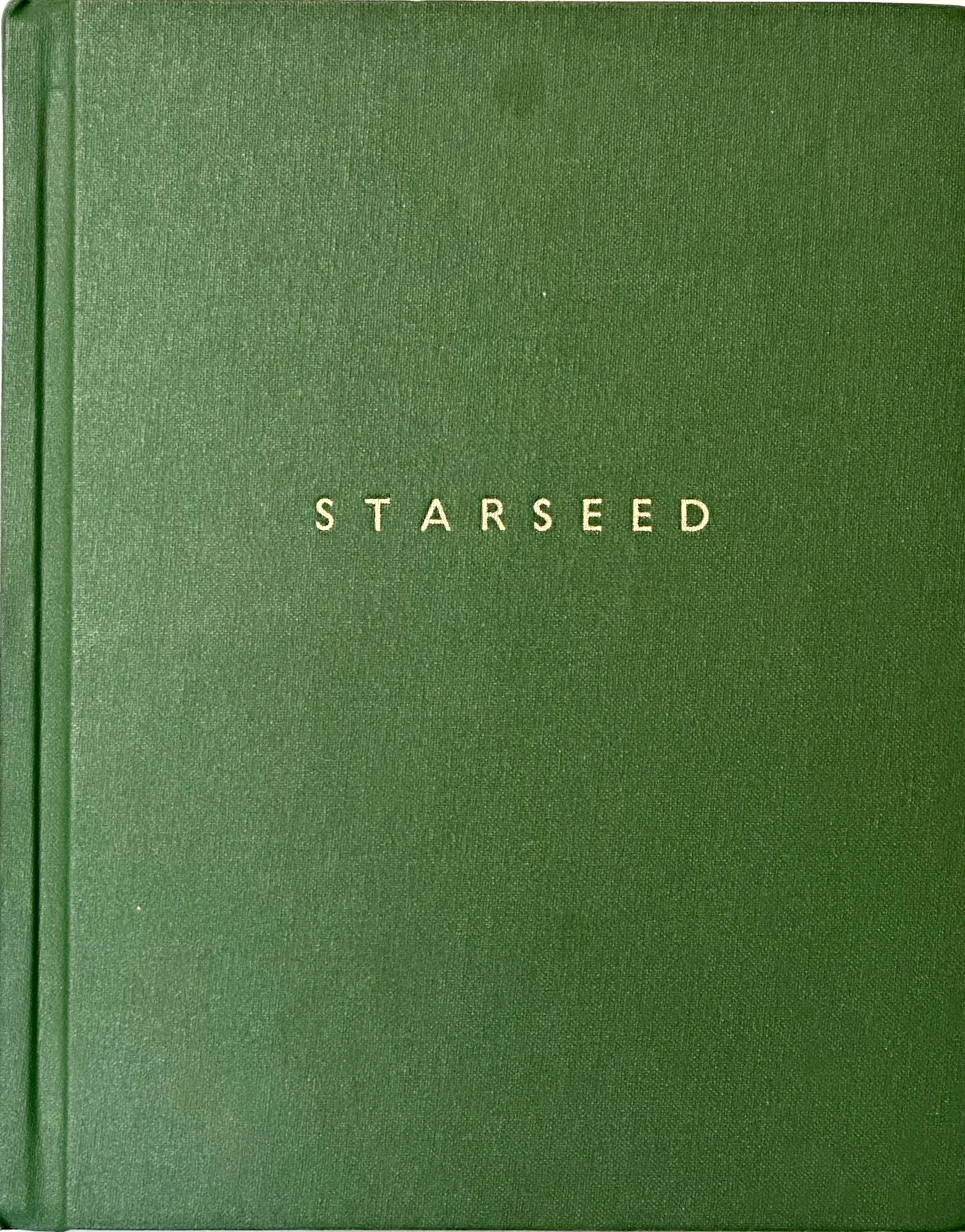 Green book with gold letters spelling 'Starseed' on the cover.
