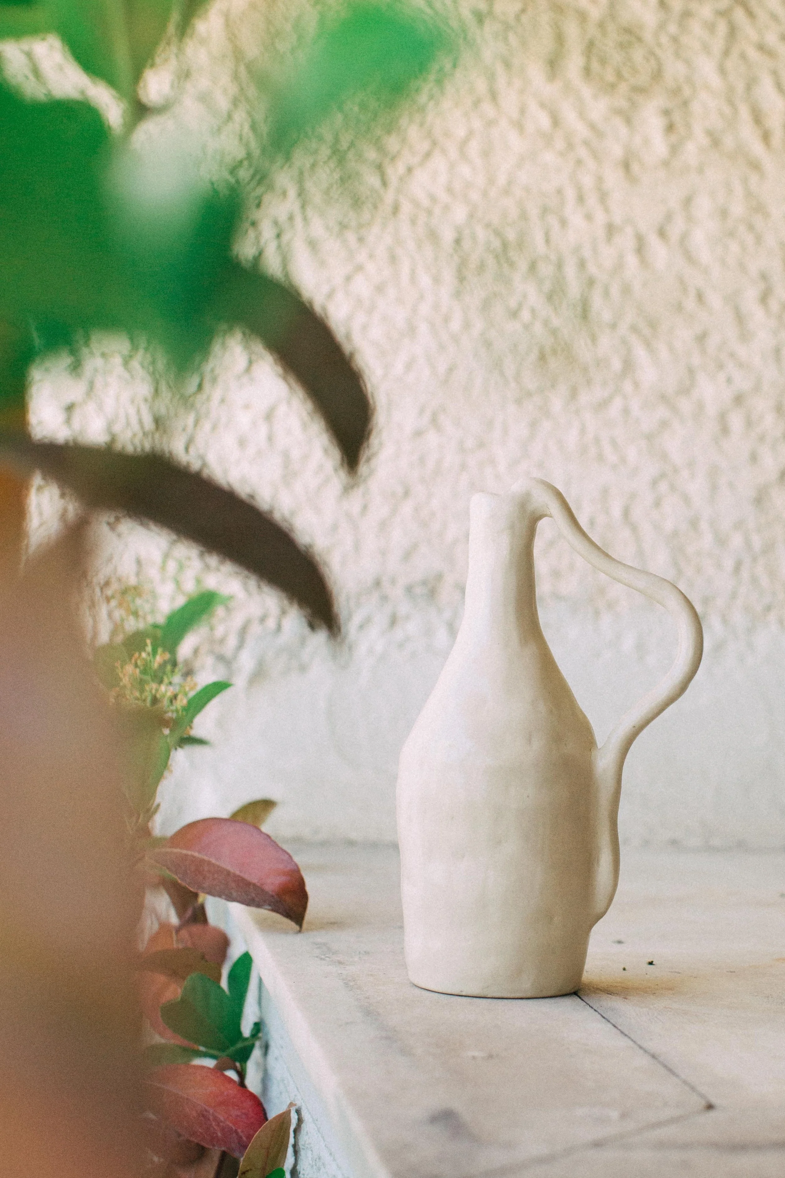 white bottle vase