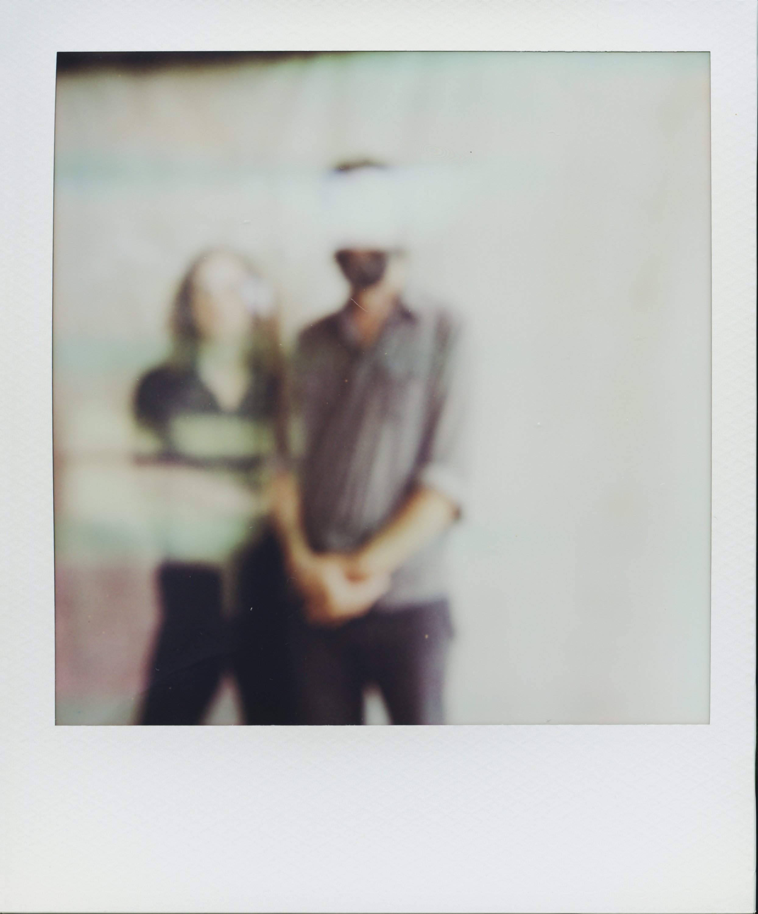 Polaroid portrait of musicians Tyler Ramsey and Carl Broemel standing together, captured for their collaborative album Celestin by Parker J. Pfister.