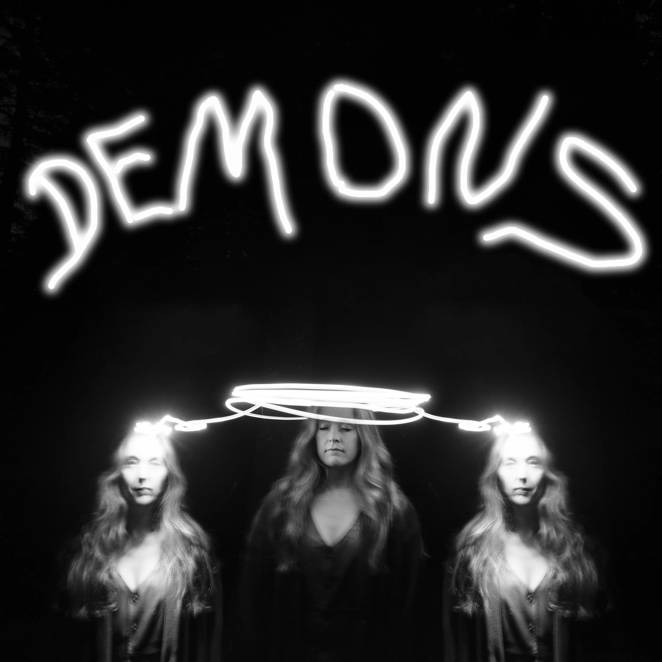 Album cover photograph for Demons by Blue Ridge Betty, featuring a black and white triple exposure portrait of Lindsay Wall with illuminated halo light effects, photographed by Parker J. Pfister.