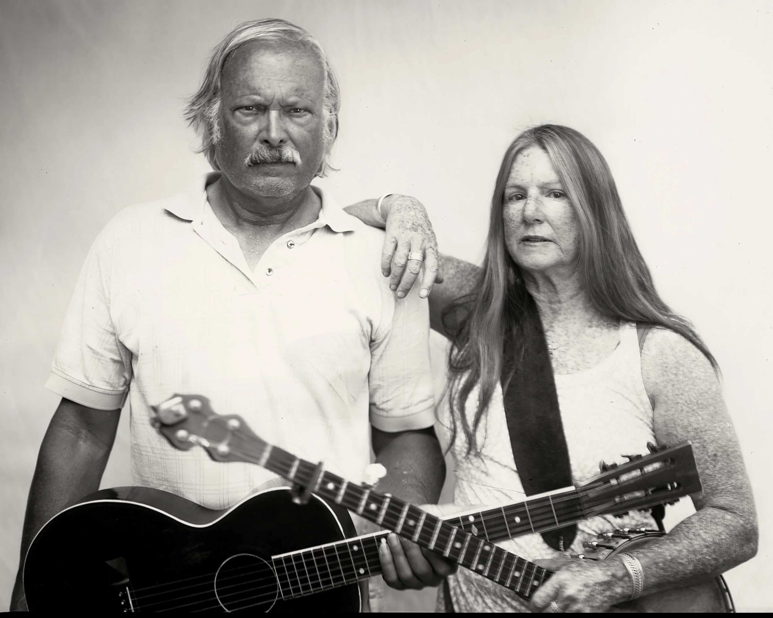 Black and white portrait of custom instrument luthier and his wife photographed in Western North Carolina by Parker J. Pfister.