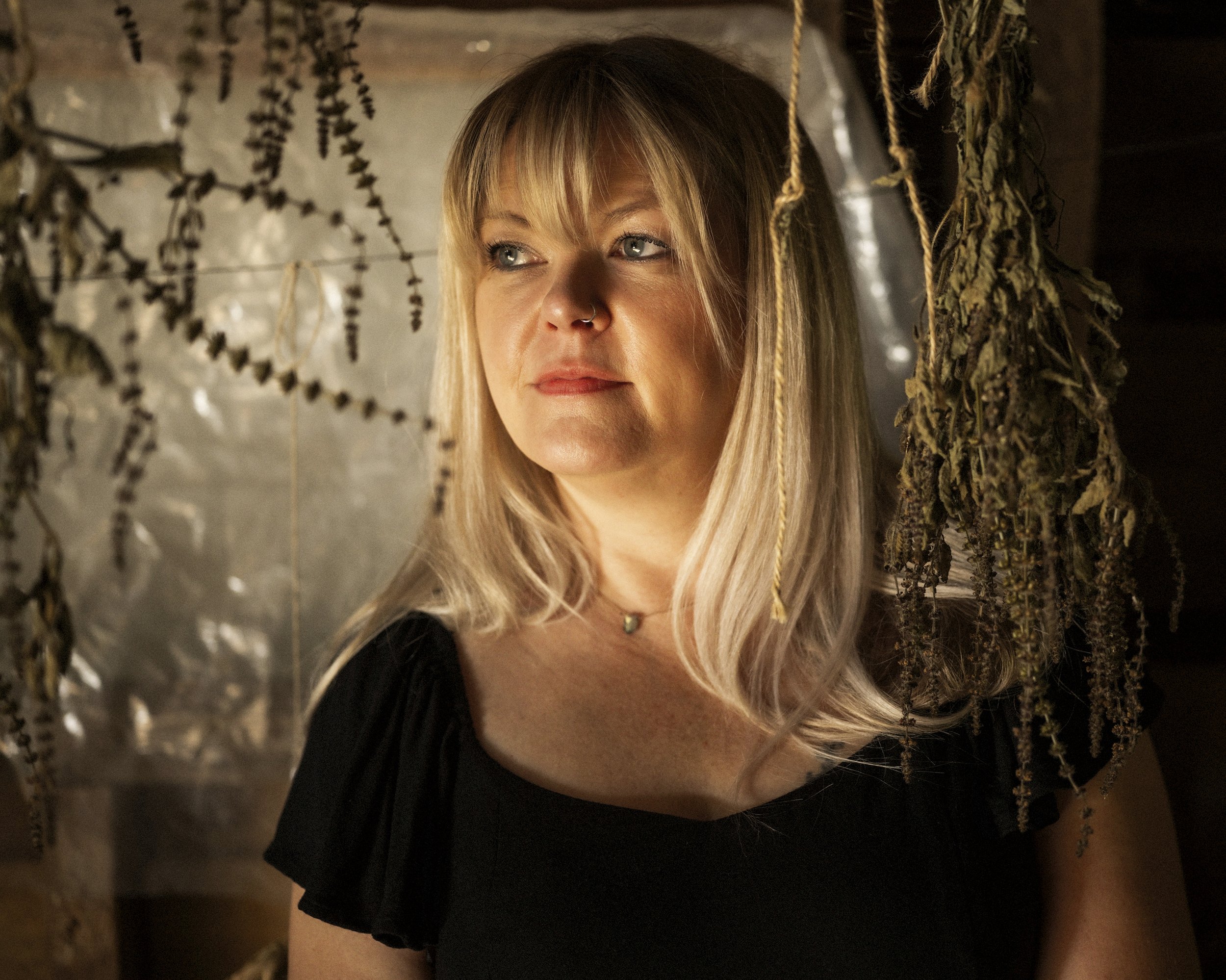 Portrait of Madison County ballad singer Donna Ray Norton in soft warm lighting, photographed in North Carolina by Parker J. Pfister.