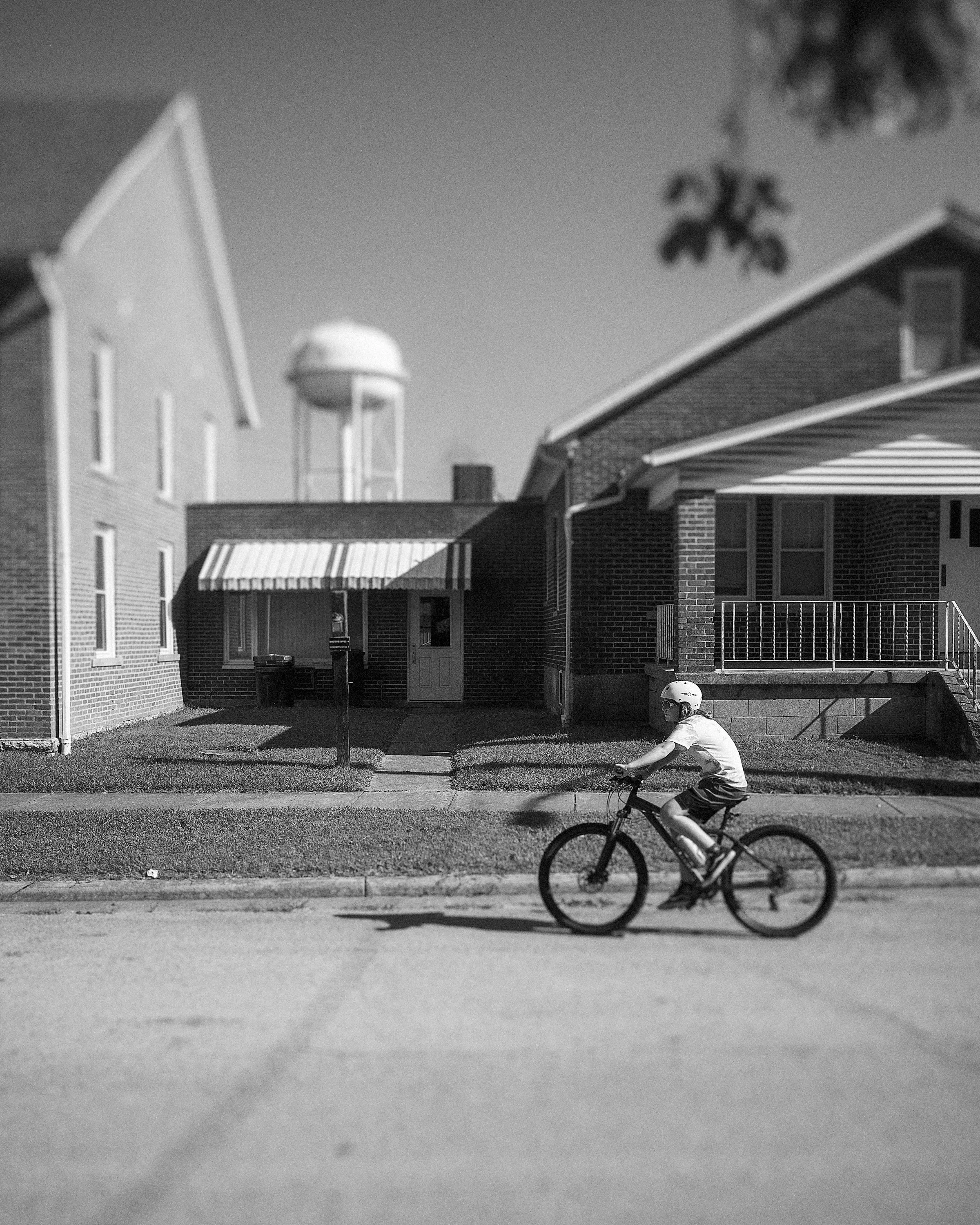 boy-riding-bicycle-street-portrait-lynchburg-ohio