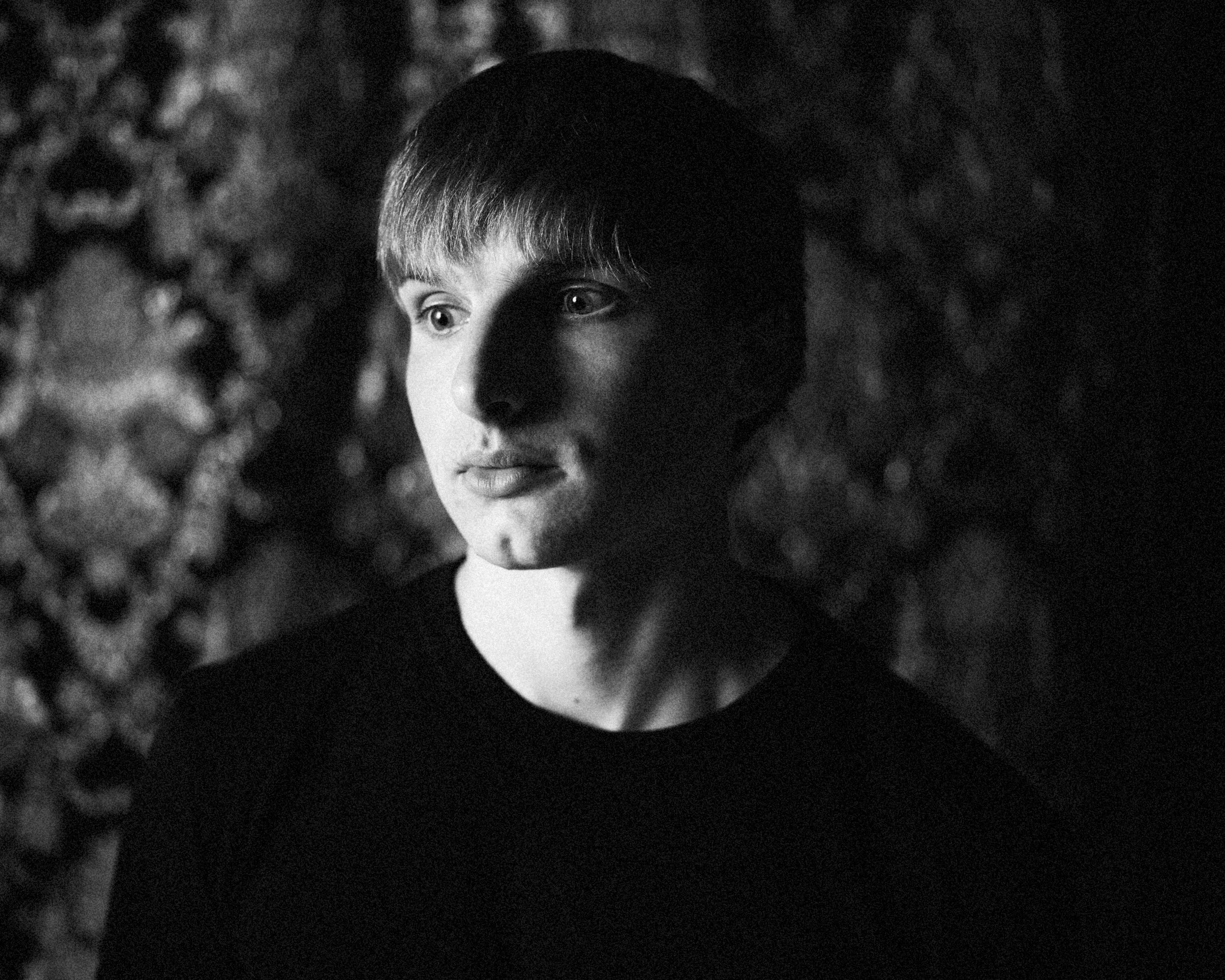 Moody black and white portrait of Asheville, North Carolina musician Alexander, photographed by Parker J. Pfister.