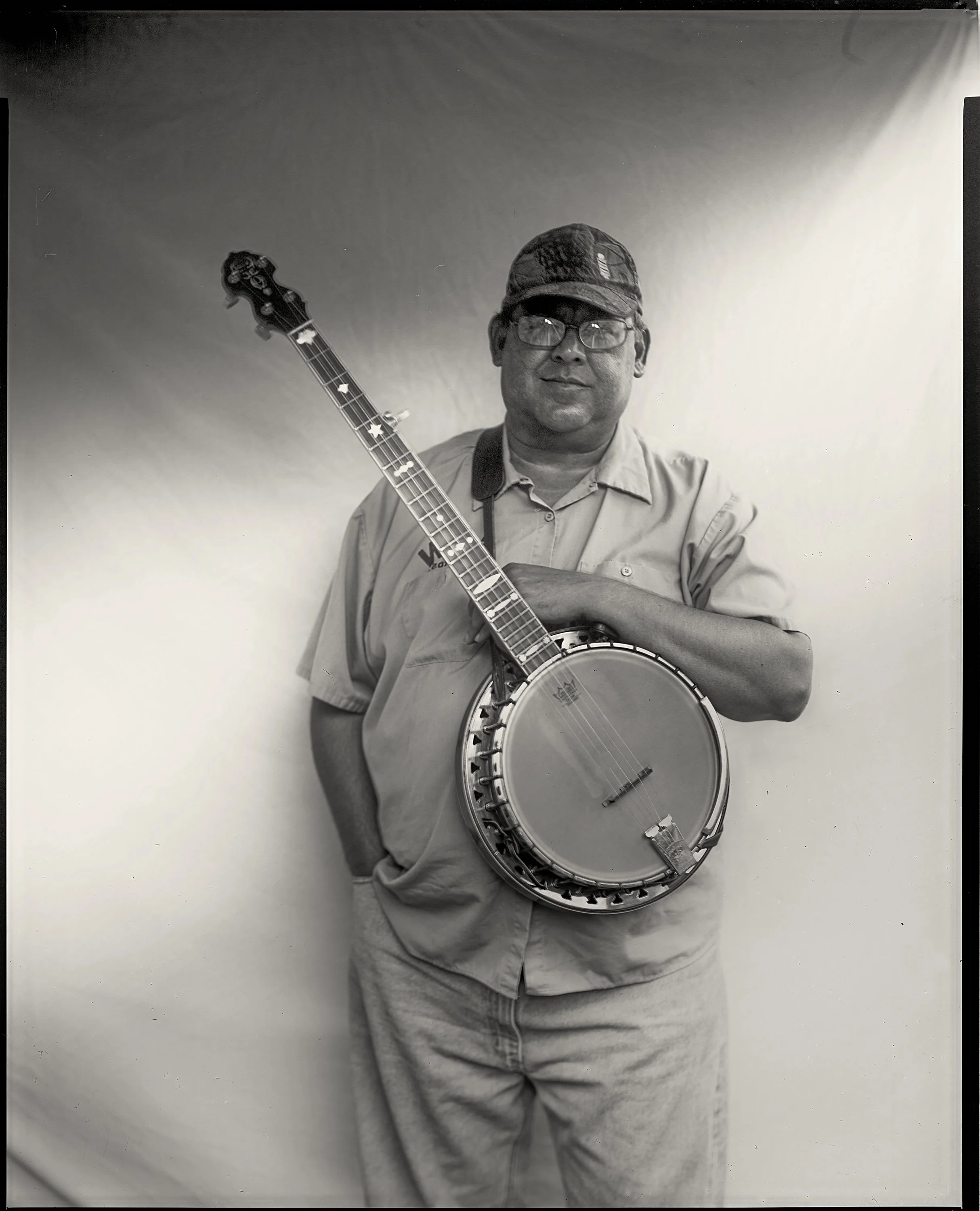 Large format 8x10 paper negative portrait of a musician captured at the Bluff Mountain Music Festival in Hot Springs, North Carolina, photographed by Parker J. Pfister.
