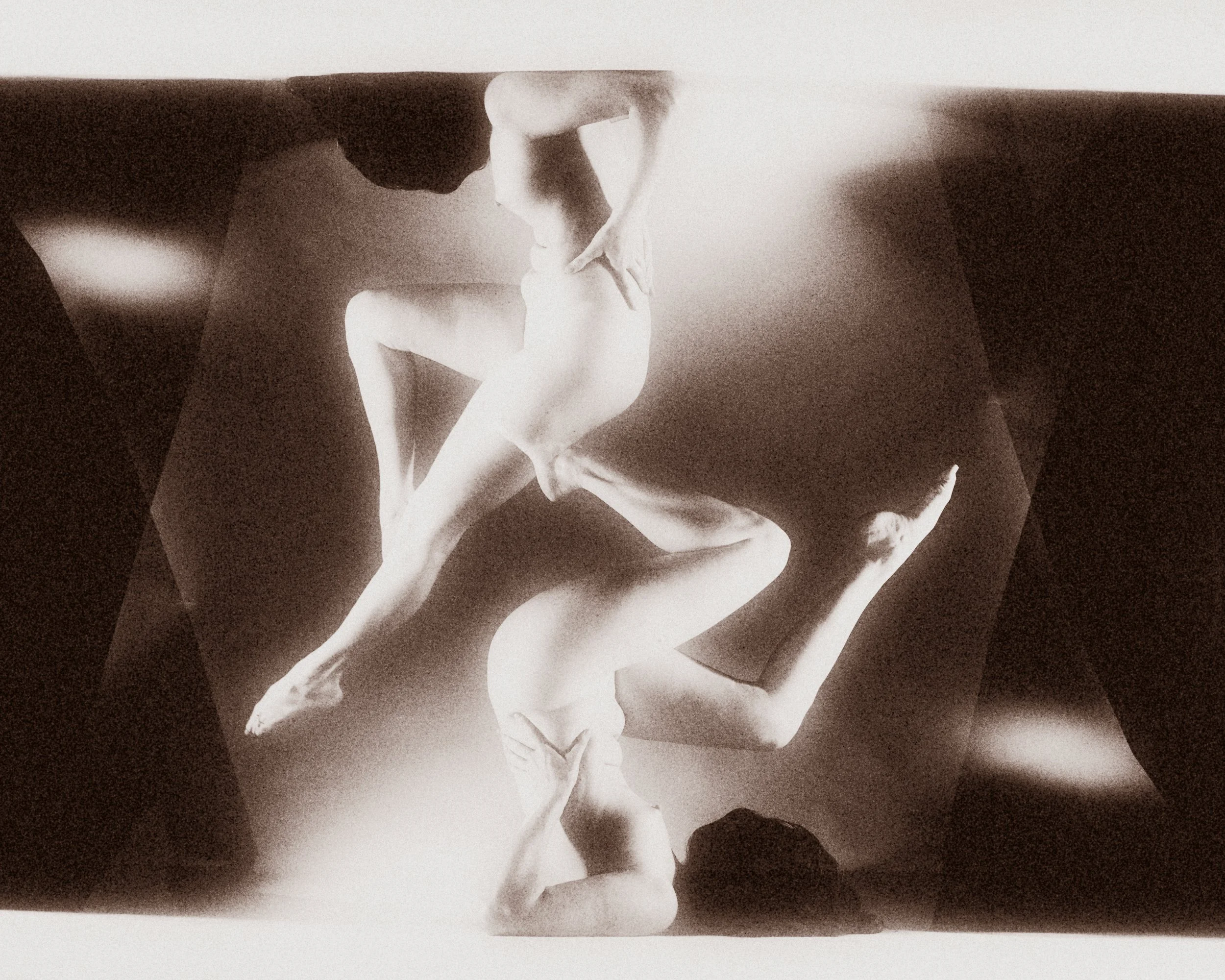 An abstract, surreal monochrome multiple exposure composition featuring mirrored and layered human forms in motion, creating a striking geometric fine art balance.