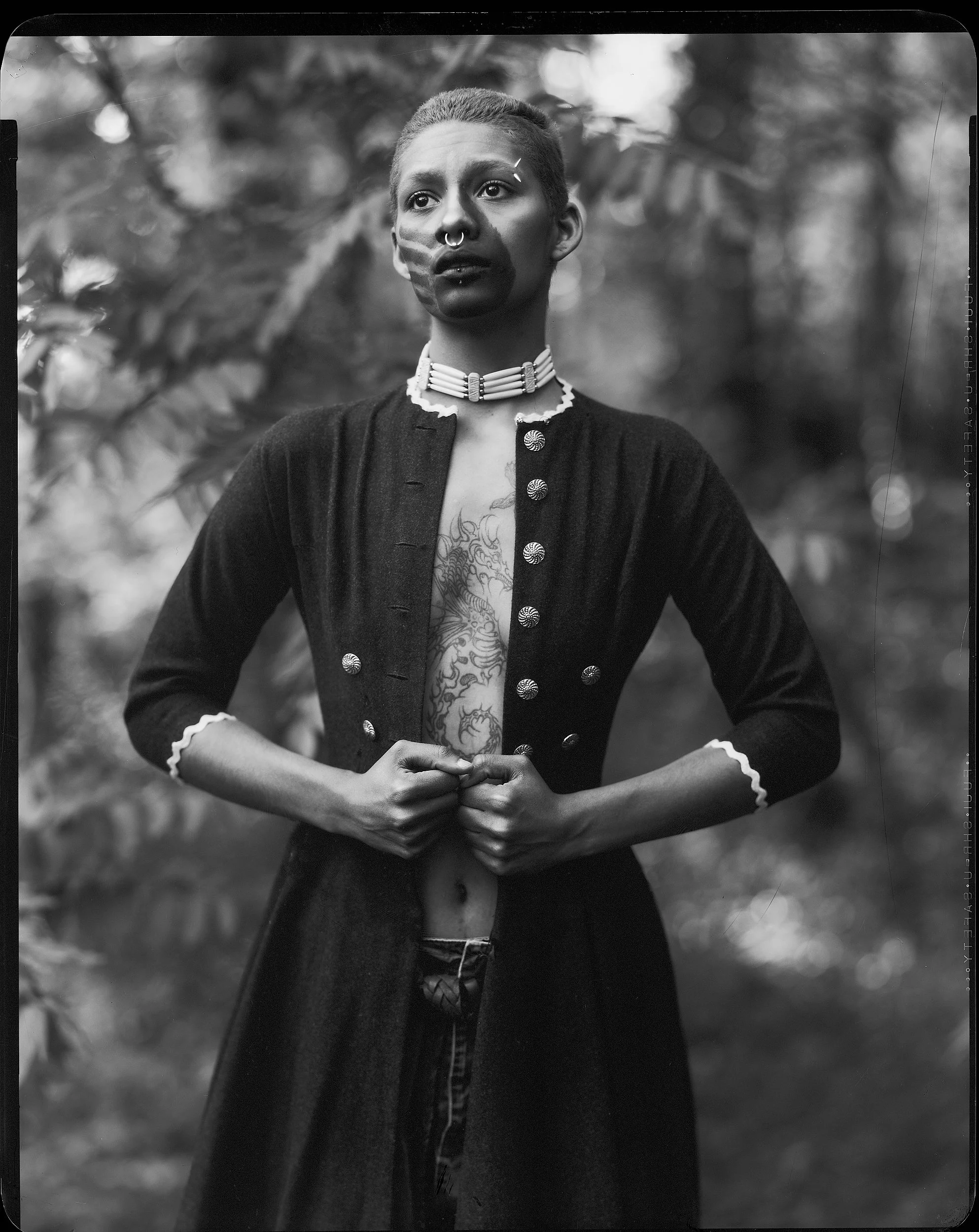 Fine art black and white large format X-ray film portrait of a young Catawba River Indigenous person with a handprint painted over their mouth by Parker J Pfister