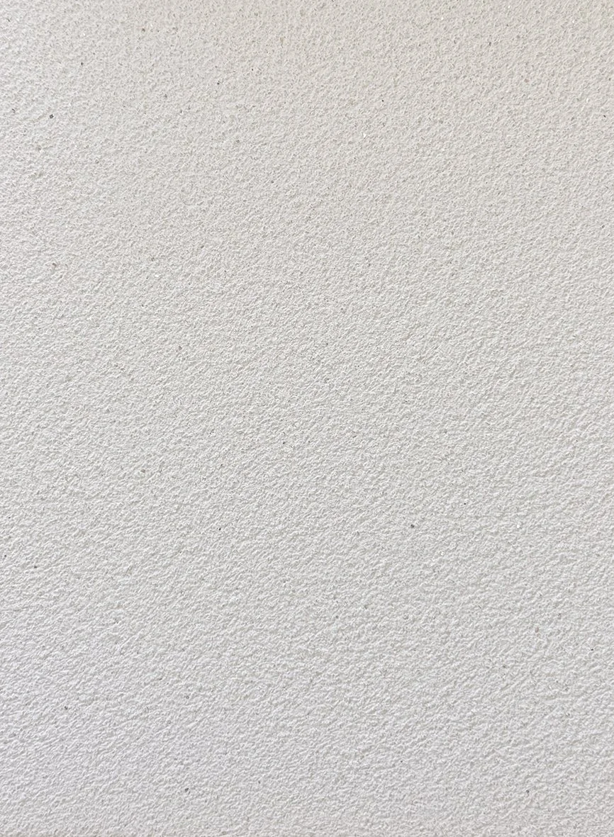 Grainy course white texture clay plaster surface