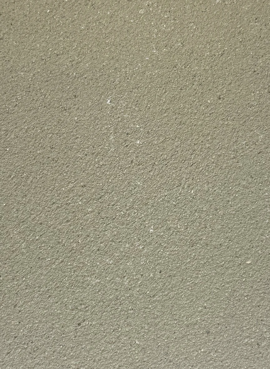 Grainy course green texture clay plaster surface