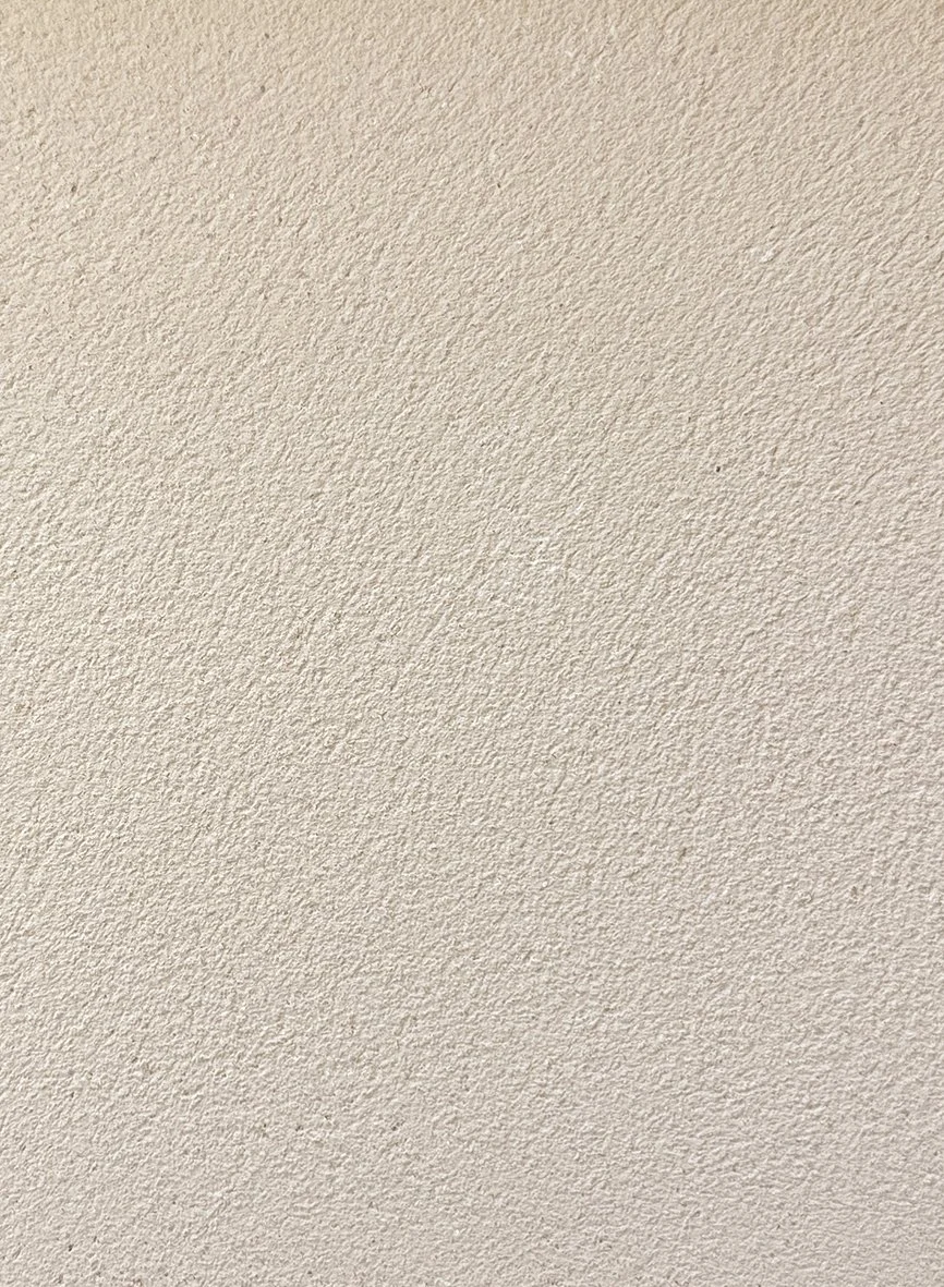 Grainy course cream texture clay plaster surface