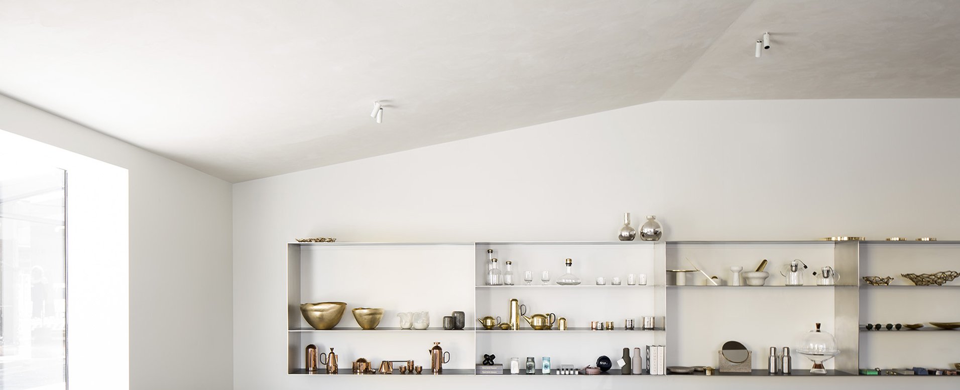 shop interior with angled rendered ceiling