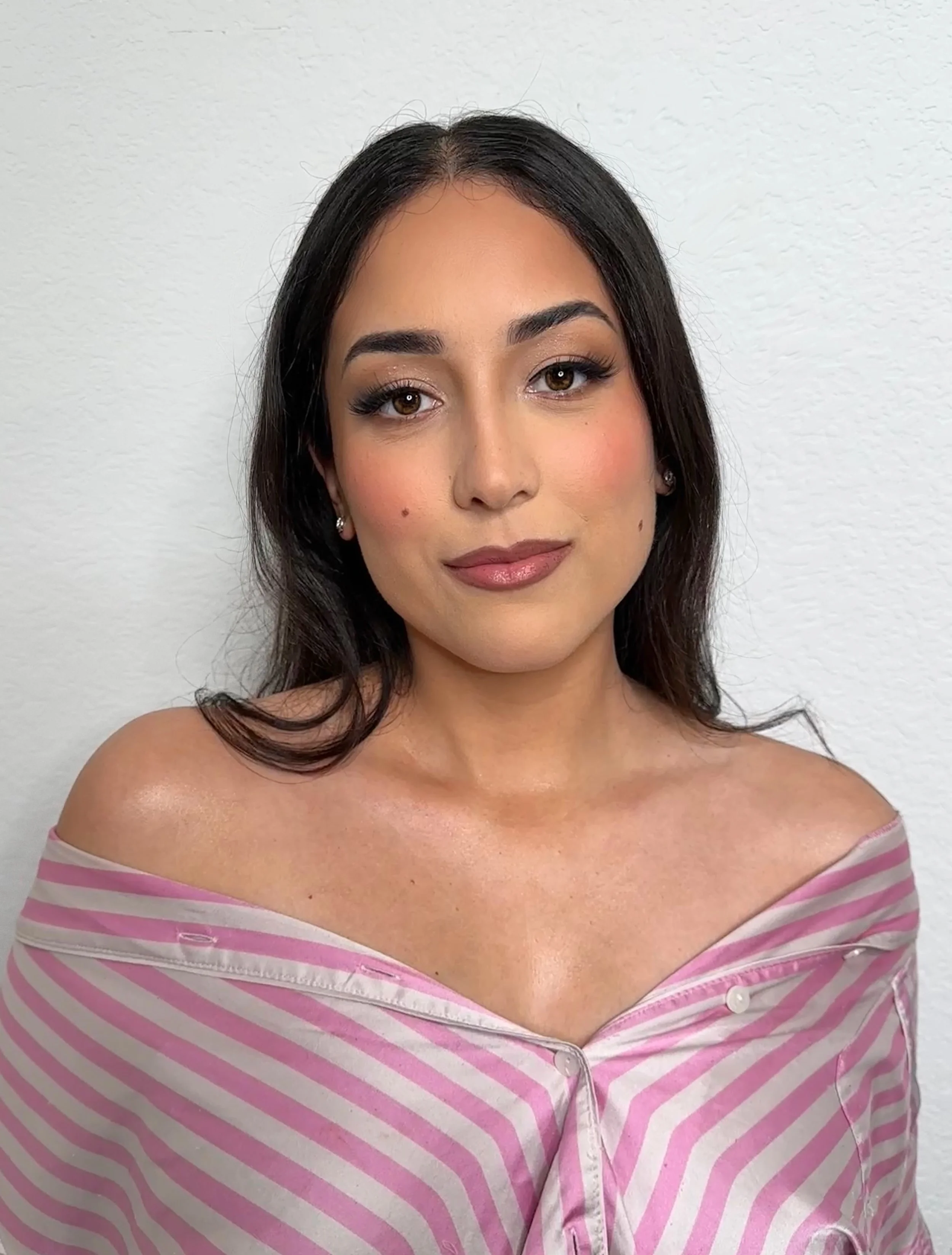 full glam makeup, with loose curls