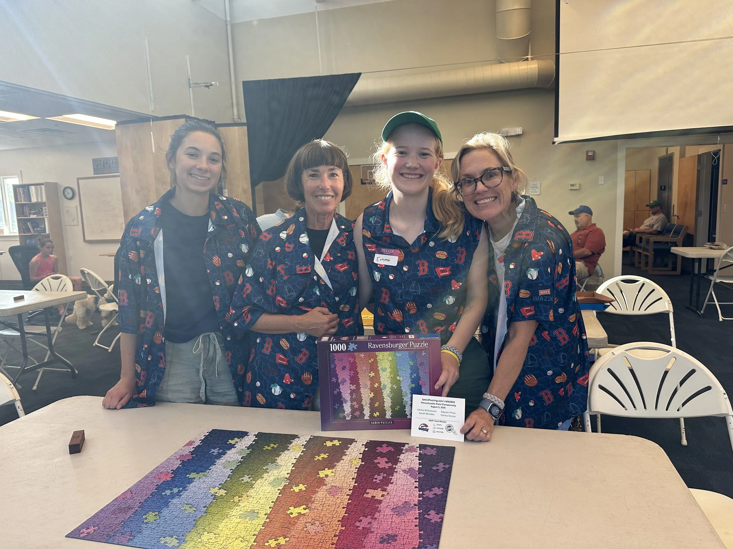 Emma's team at her first-ever puzzling competition, with her mom, best friend, and her mom. 