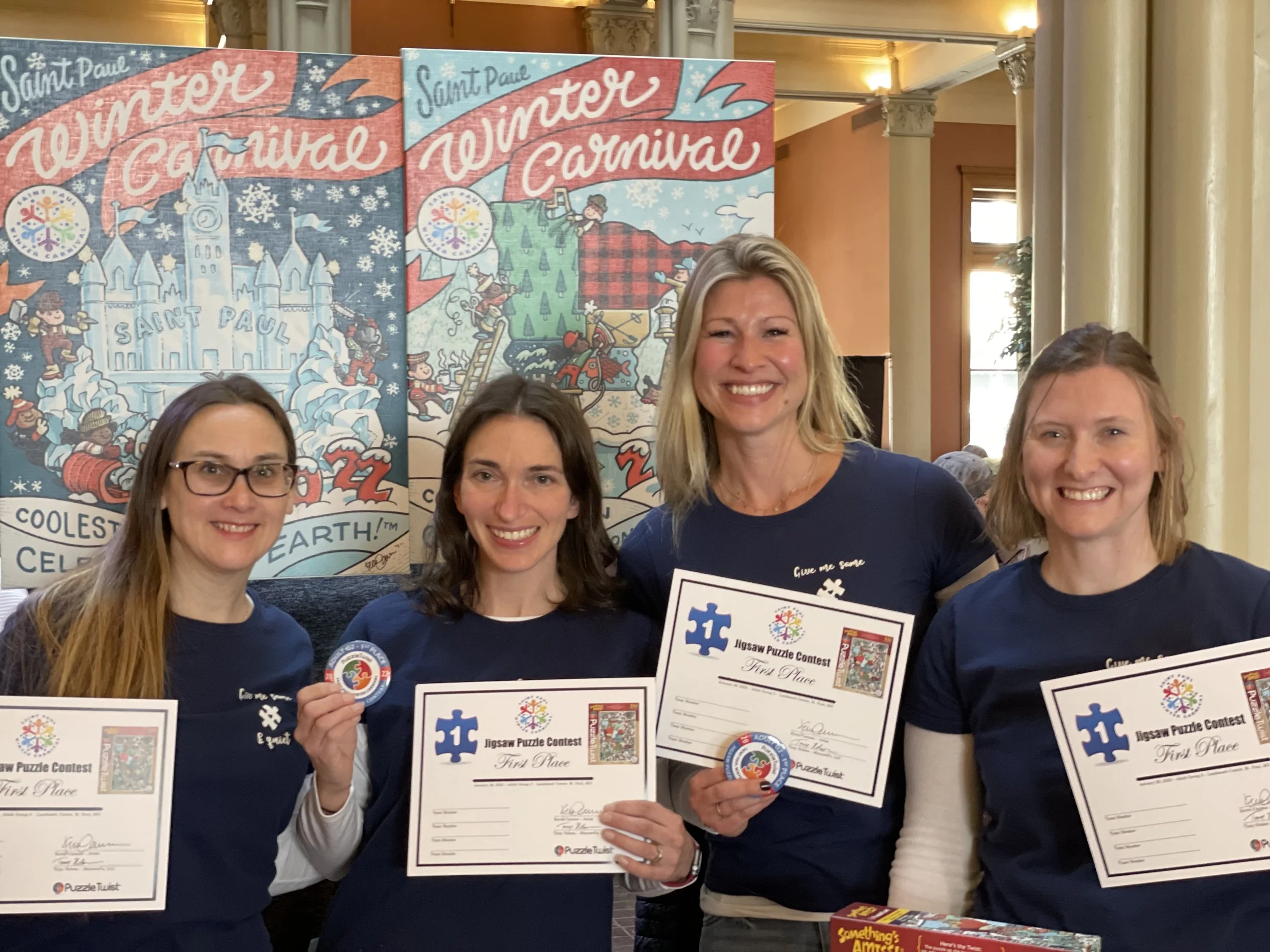 Team Puzzle Moms - First Place in their division at the 2022 St. Paul Winter Carnival. (From left to right: Kim, Katie, Megan, Heather)