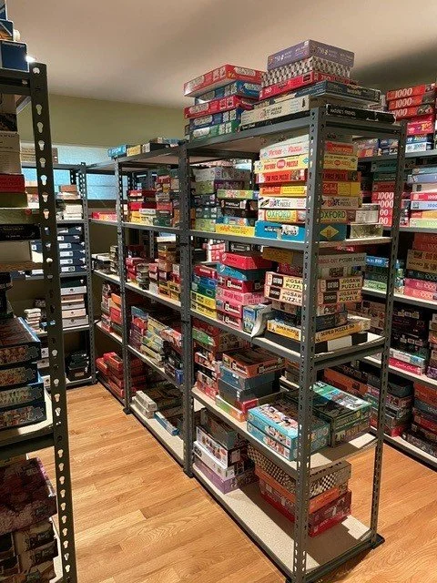Her husband helped her put together this puzzle room, still needs a bit of organizing