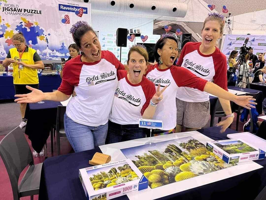 “Odd Birds” celebrating after their Teams Prelim round at the 2024 World Jigsaw Puzzle Championship. (From left to right: Faith T., Turtle M., Min D., Jamie A.)