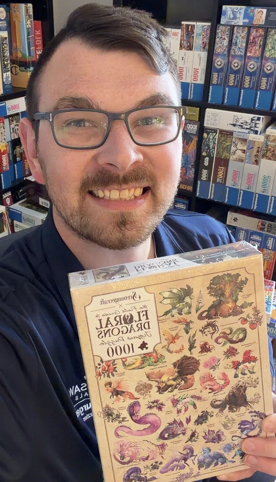 Nicholas holding a copy of a puzzle based on art from "The Field Guide to Floral Dragons" for which he was an
editor