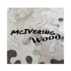 Close-up of a wooden puzzle with the words "Mitering Wood" written on it.