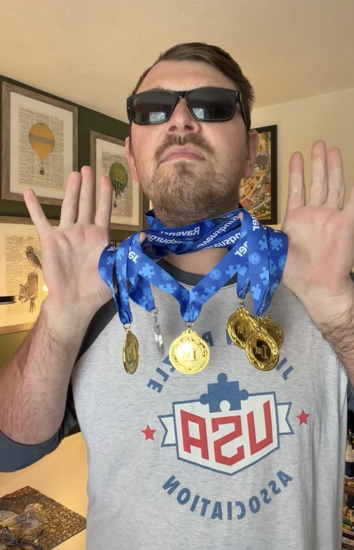 Nicholas poses with his medals from speed puzzling events.