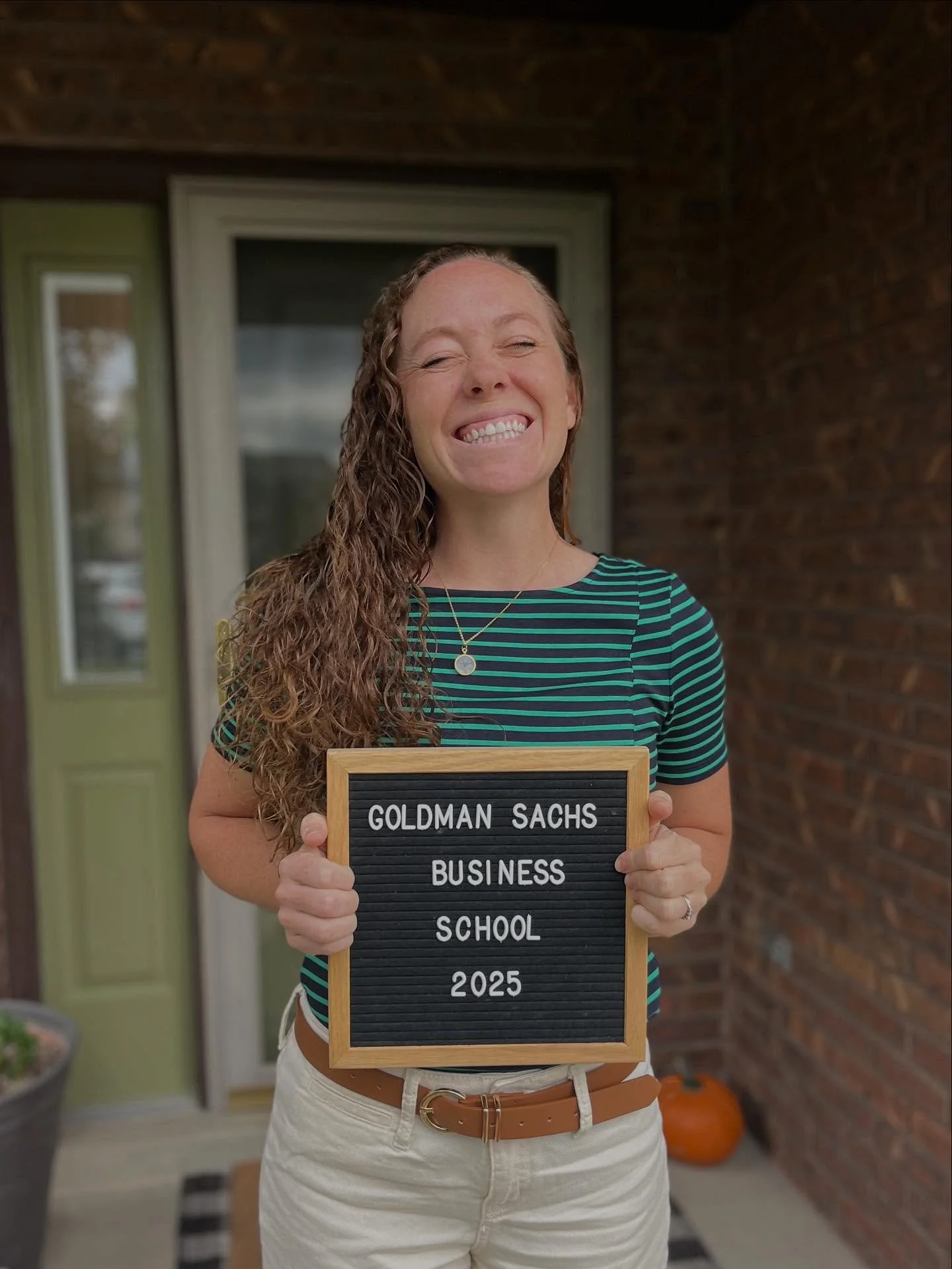 Earlier this year Amy applied for the Goldman Sachs’s 10,000 Small Businesses Program.  She got in and today is her first day.
I rustled up this sign from her basement and made her take an obligatory “first day of school” picture.