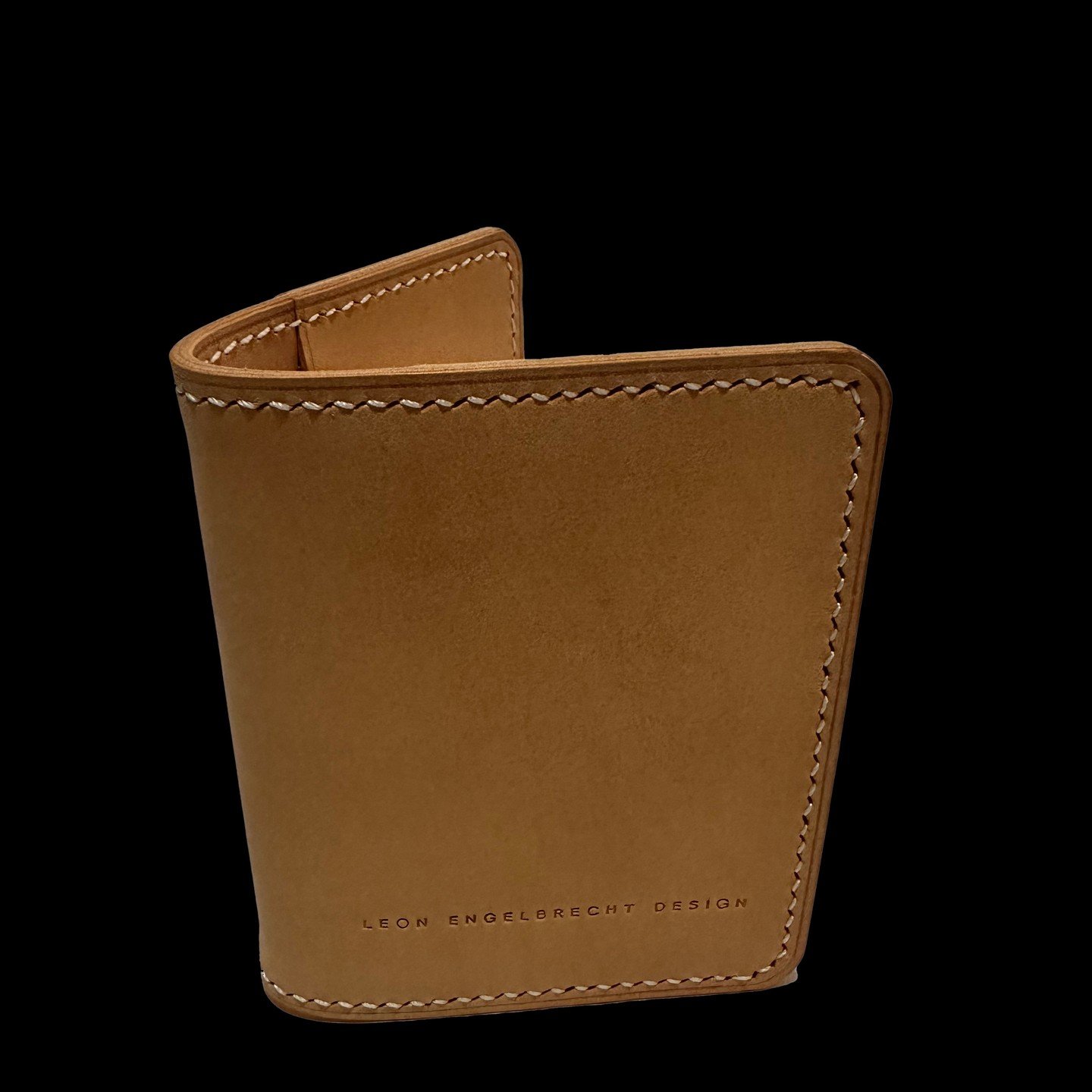 Crafted from full-grain leather, the Namib Kaart Wallet features a classic bifold with four interior card slots, one exterior slot, and a deep cash slot. Carry your cards in style with this low-profile, simple accessory. .............................