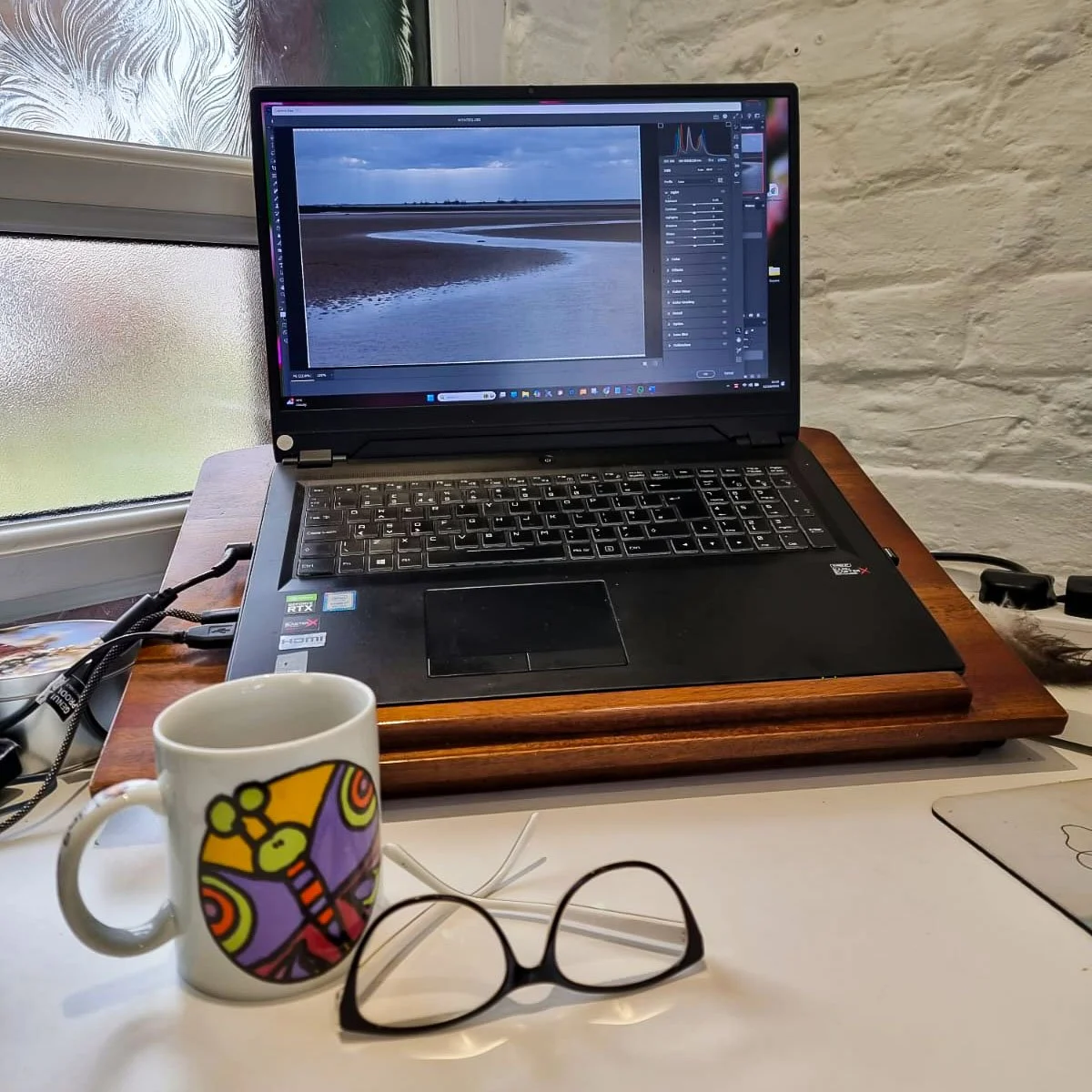 Mondays are for the quiet work &mdash; sorting, remembering, rediscovering.
Back at the gallery, the kettle&rsquo;s on, the laptop hums, and the light finds its way across the desk.
The sea still lingers in the images on screen &mdash; a calm reminde