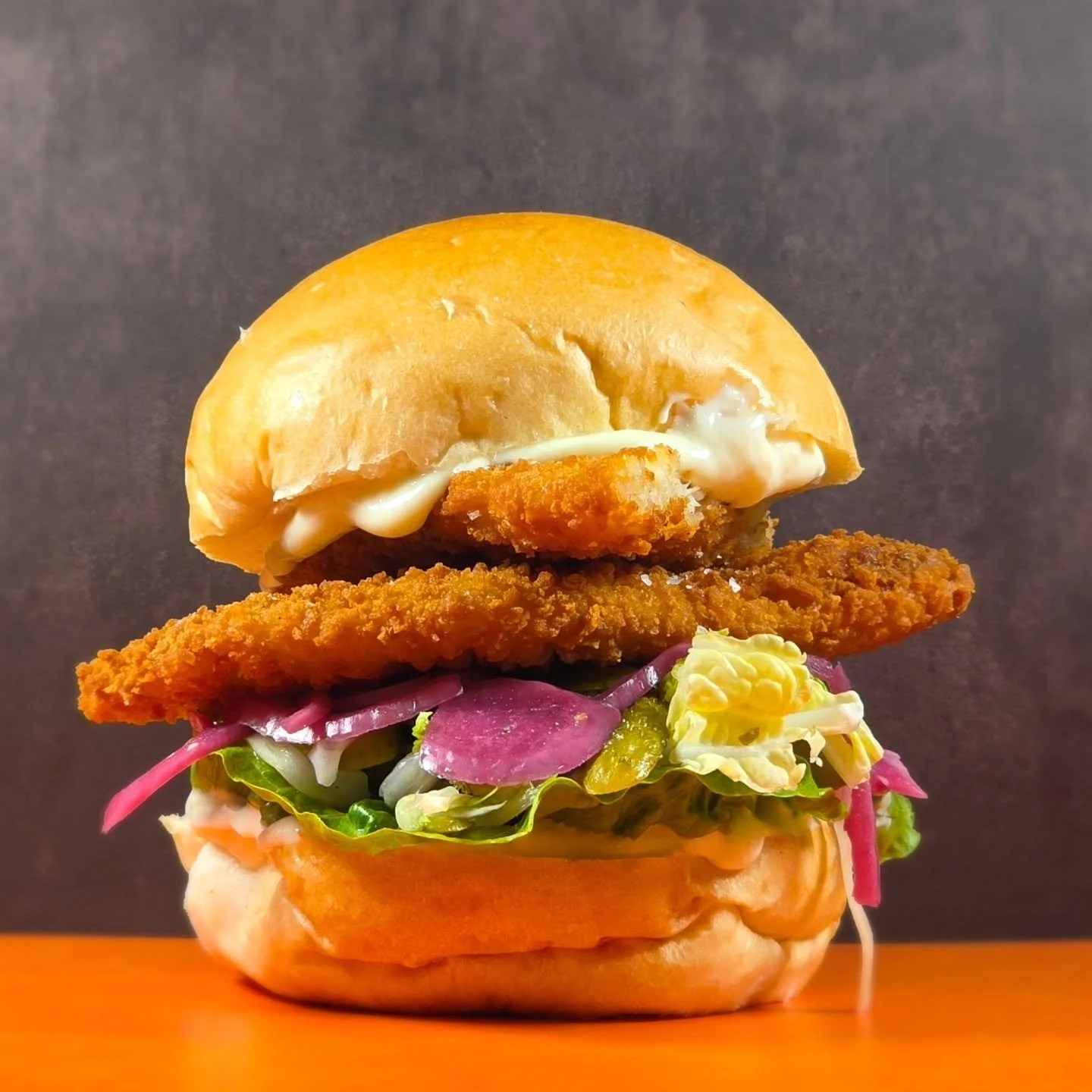 The Crispy Classic is calling your name! 👀

Whats in it? 👇

&bull; Breadcrumbed Plaice 
&bull; Pickles 
&bull; Aoili 
&bull; Lettuce 

Served in a fresh vegan brioche bun! 

Available from 12pm every day ✅️

#crispyclassic 
#localingredients 
#fres