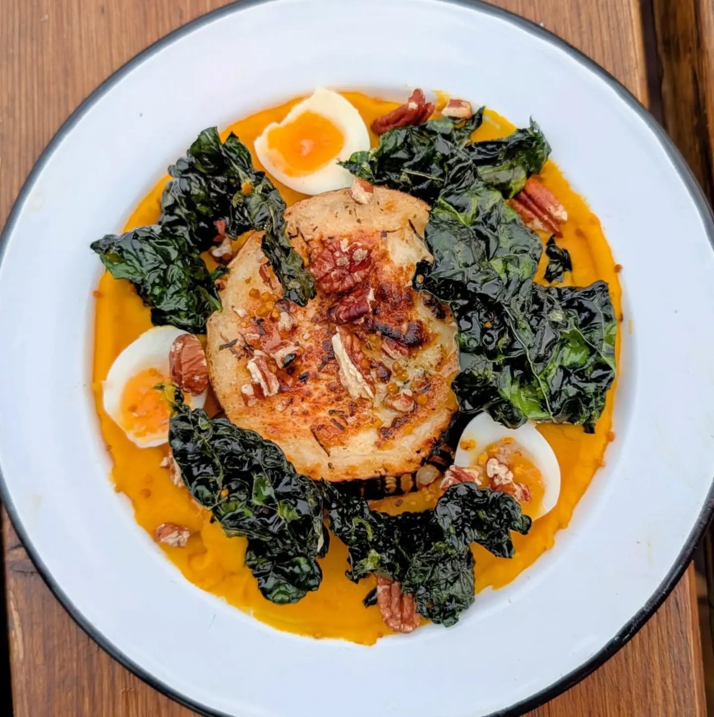 Baked Goats Cheese, Crown Prince Puree, Toasted Pecans, Crispy Kale &amp; St.Leonards Honey 🍯 

This is one *tasty* dish - try it now at #fireonthebeach - booking link in bio 🔗

🔥 🔥 🔥 

#bakedgoatscheese
#stleonardshoney 
#fireonthebeach
#goatle