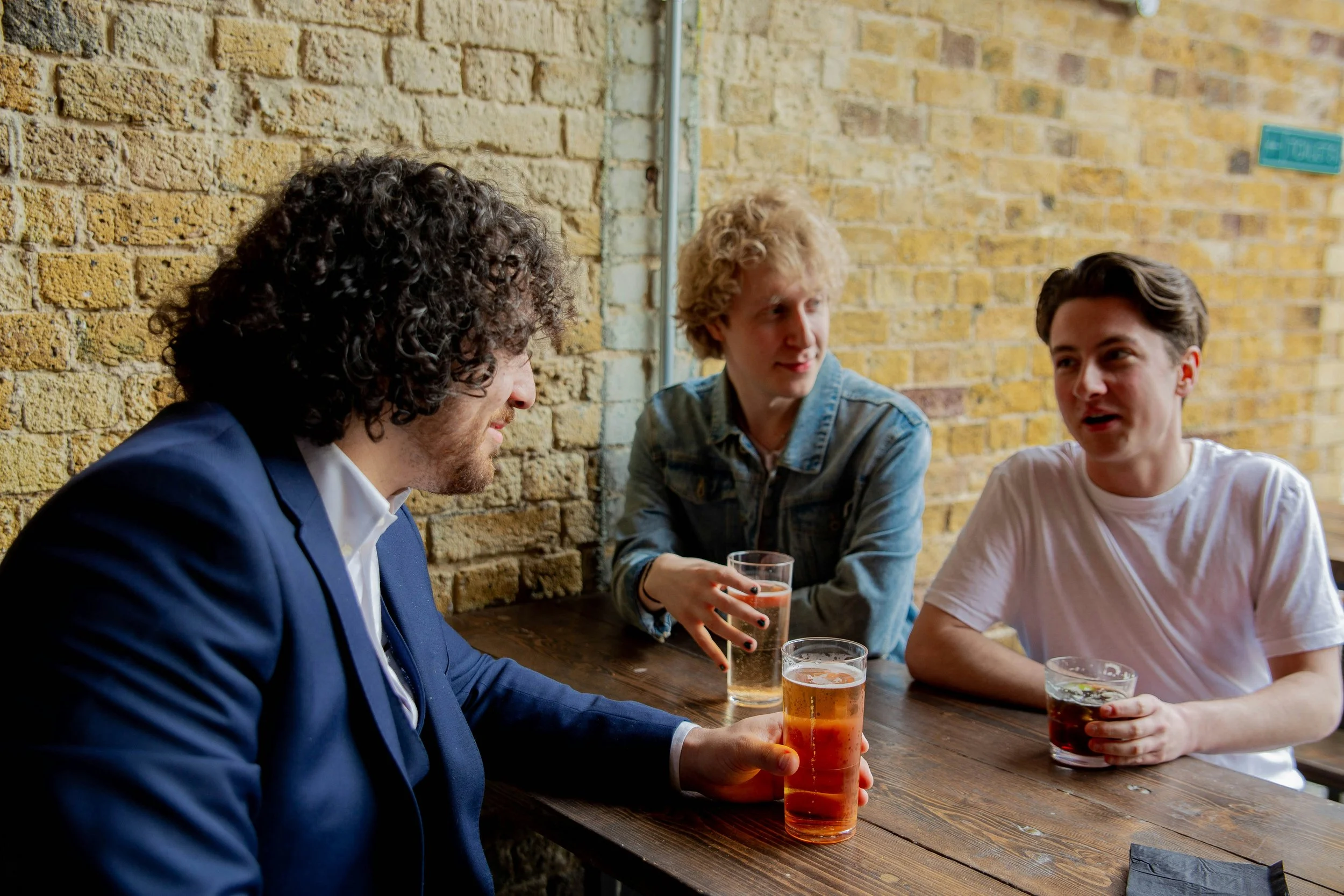 Group of men gathering and talking together