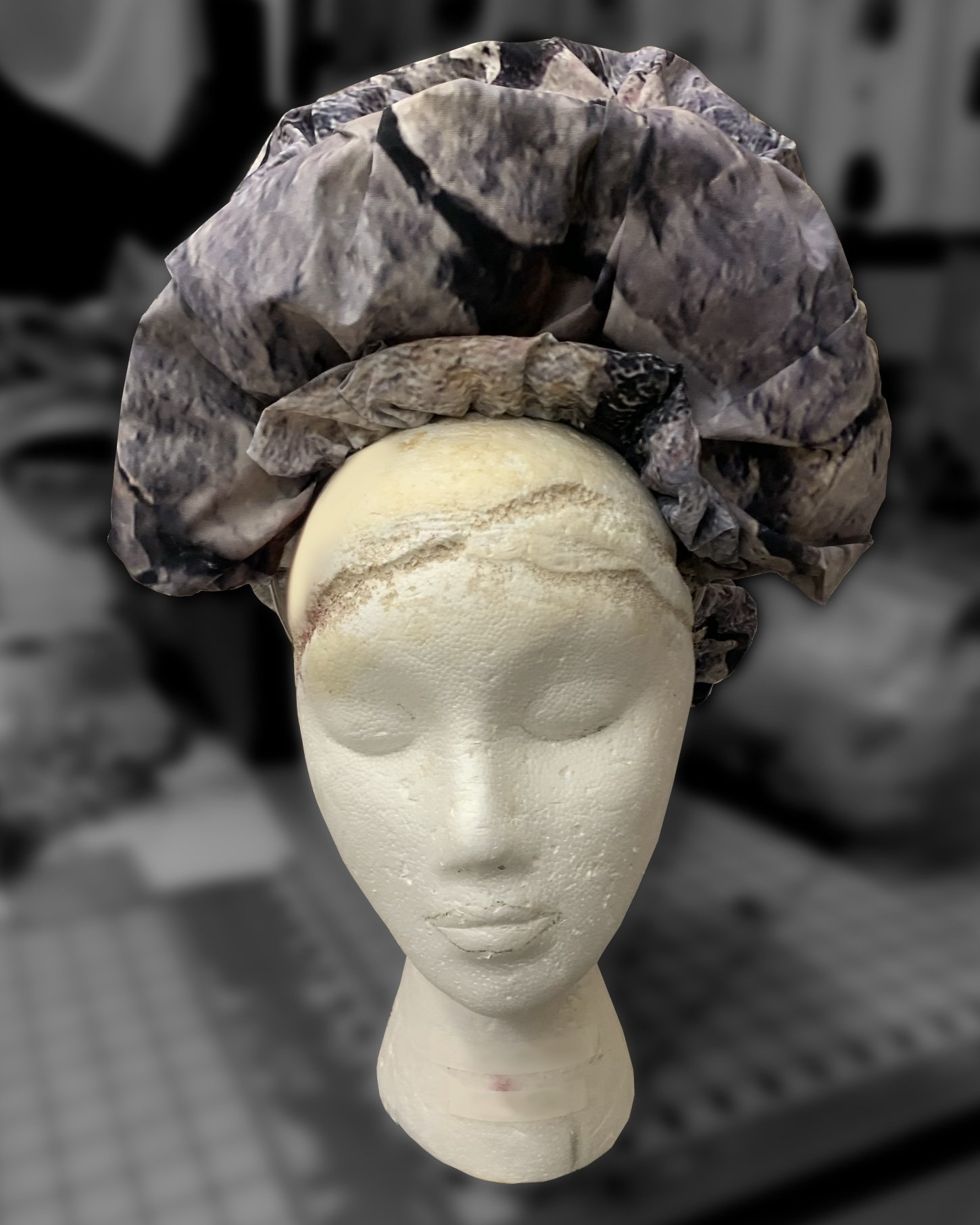 Metal crescent shaped headband used as base and covered with printed vinyl and stuffed with polyfill for texture