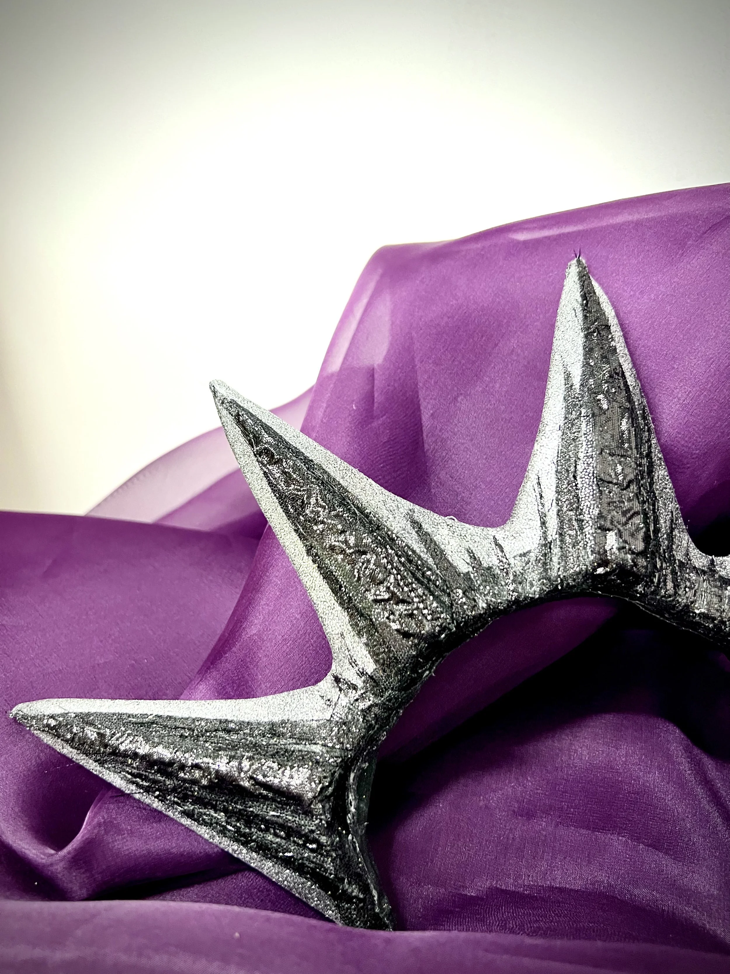 Acrylic painted EVA foam embellished with cut pieces of fabric