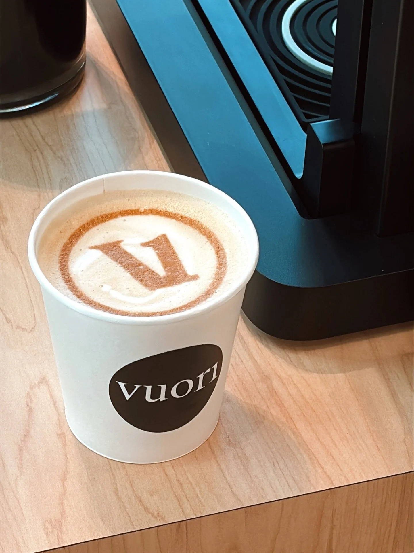 An in-store coffee activation at Vuori UTC Sarasota, where guests received complimentary espresso drinks while shopping.

The branded coffee cart and logo-printed latte art were designed to align with the store&rsquo;s aesthetic, allowing the coffee 