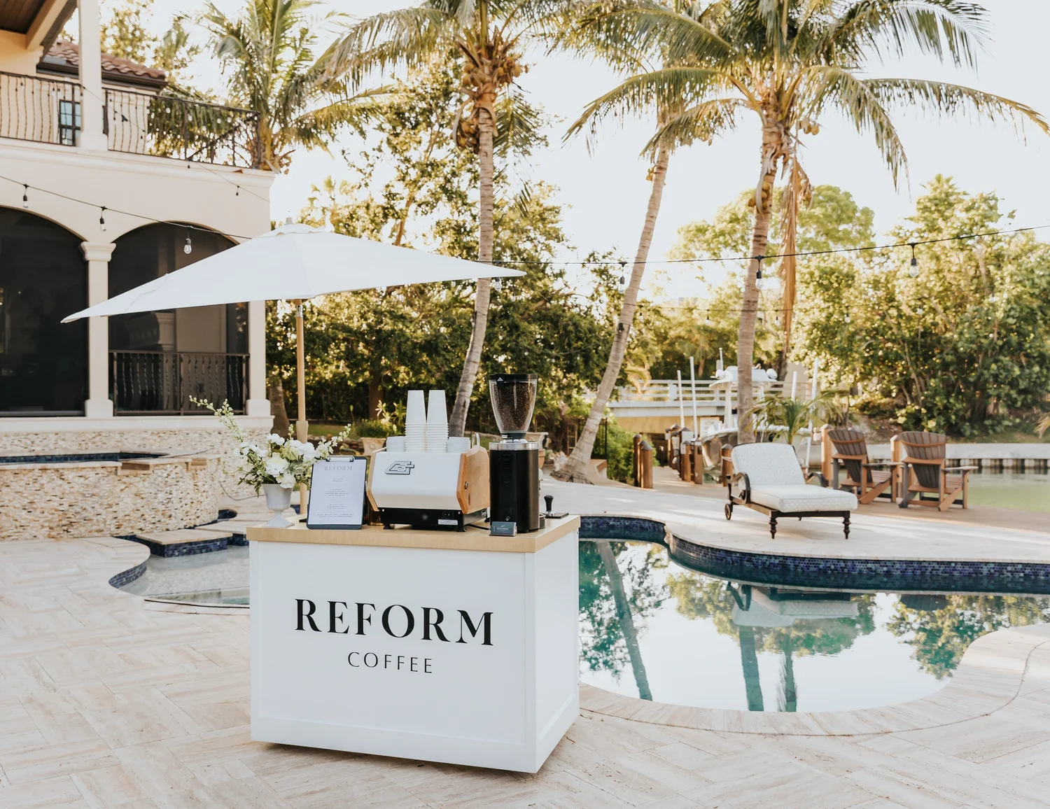 Reform Coffee mobile coffee cart set up poolside at a luxury event in Sarasota