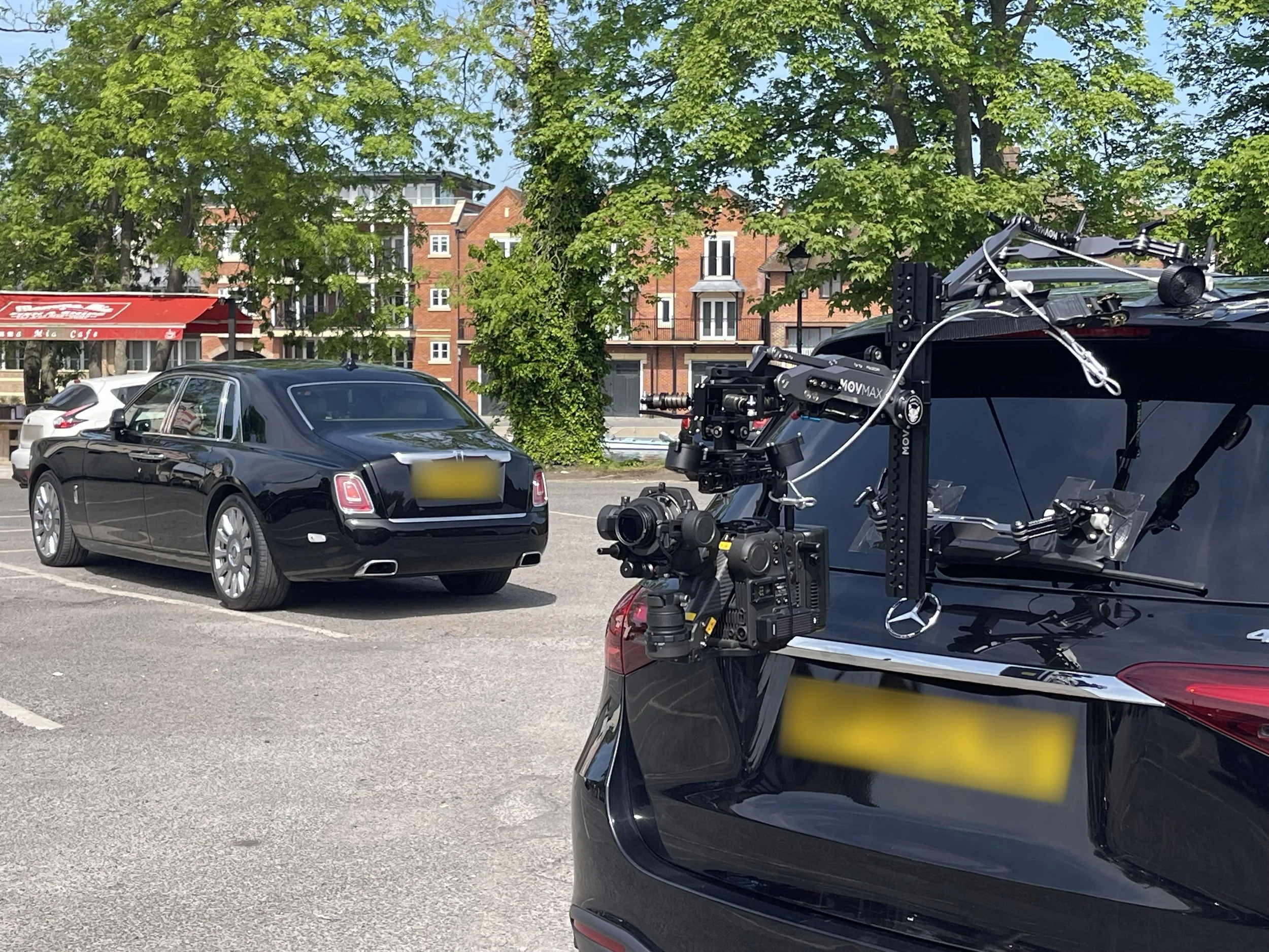 DJI Ronin 4D on a MOVMAX Razor Arm car mount, set up for a car-to-car tracking shot of a Rolls-Royce