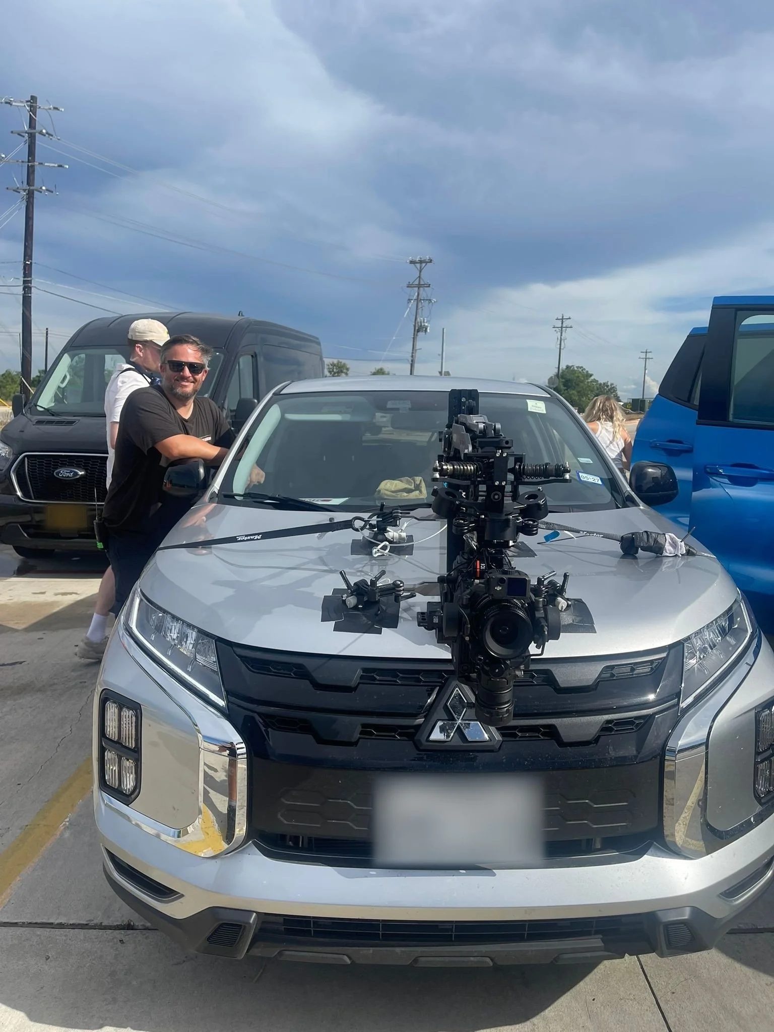Andy Seggins with a DJI Ronin 4D on a MOVMAX Razor Arm hood mount for car tracking shots