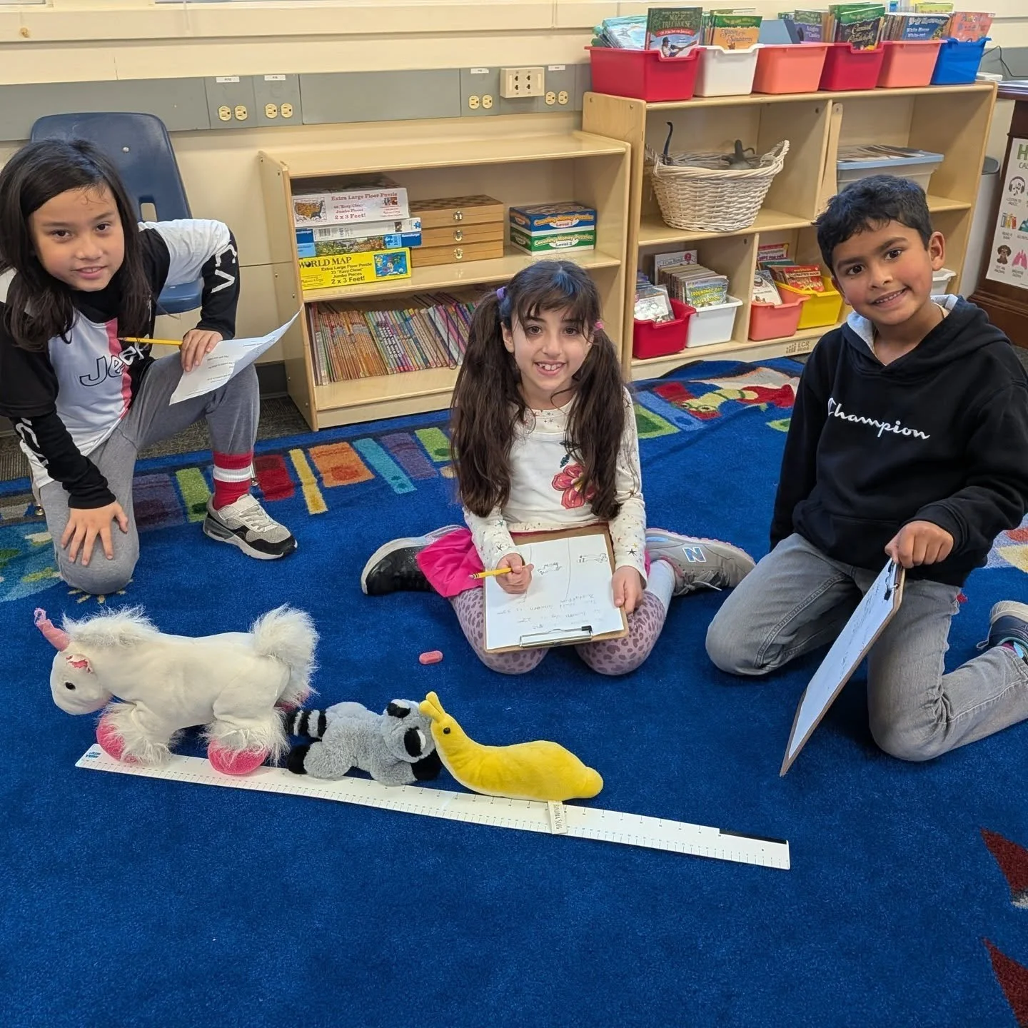 Hands-on learning in action! 🧸📏

Our 2nd graders are working together to figure out how many stuffed animals it takes to fit on a broomstick. Let's talk about fun math problem-solving! Through teamwork,
 measuring, estimating, and lots of discussio