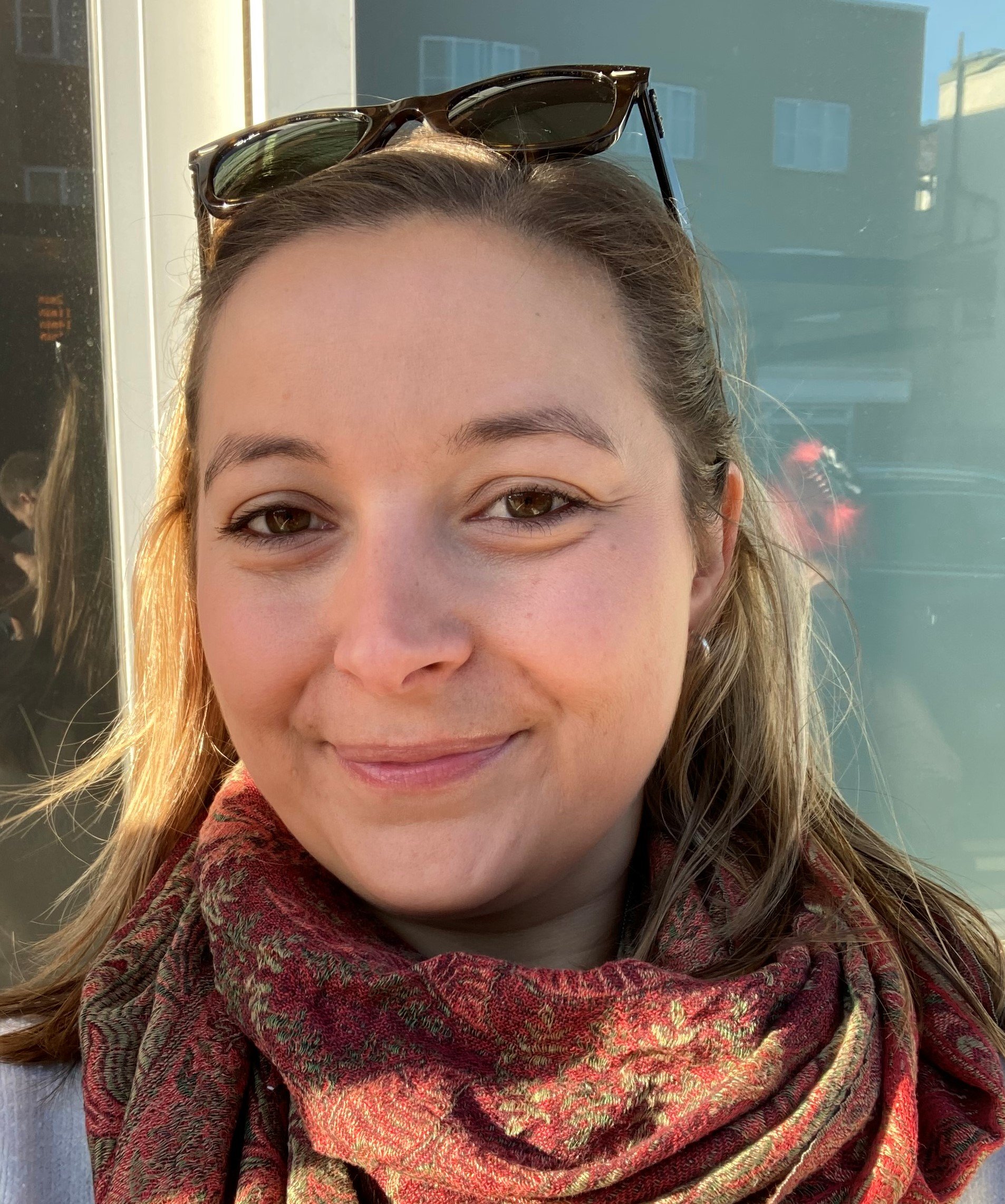 Emily smiling and welcoming you to get in touch